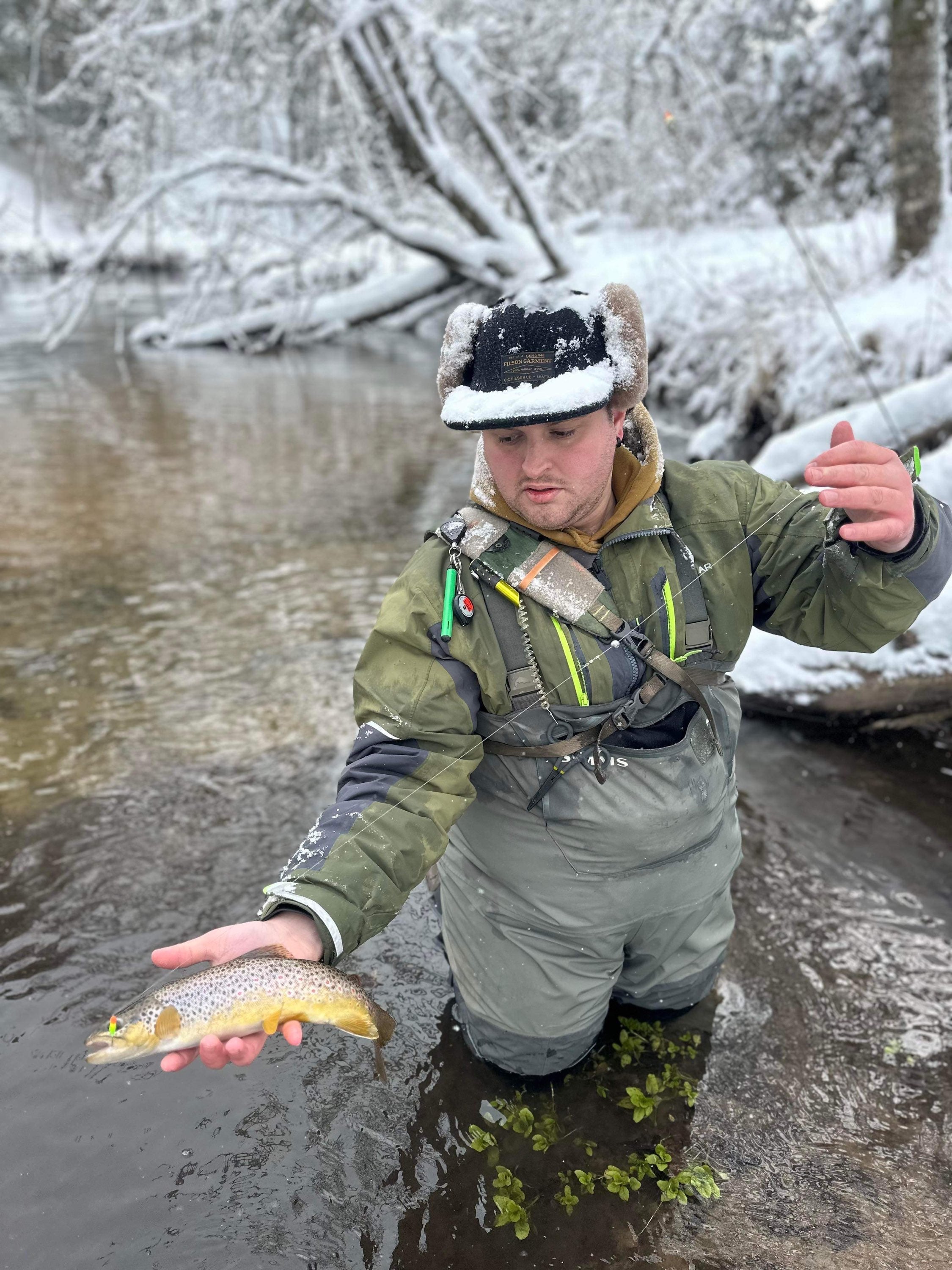 Steelhead tube jig with neon orange-and-lime paint scheme