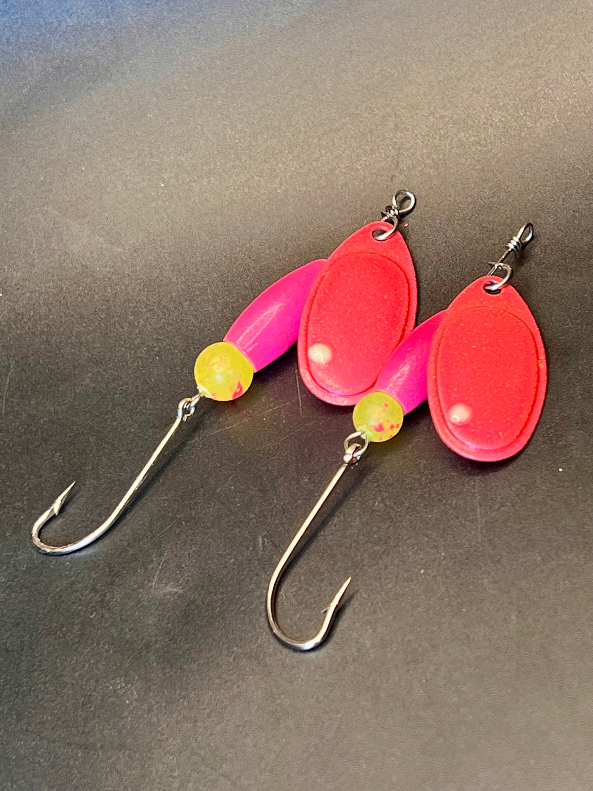 Set of two red/pink inline spinner lures with yellow beads and treble hooks