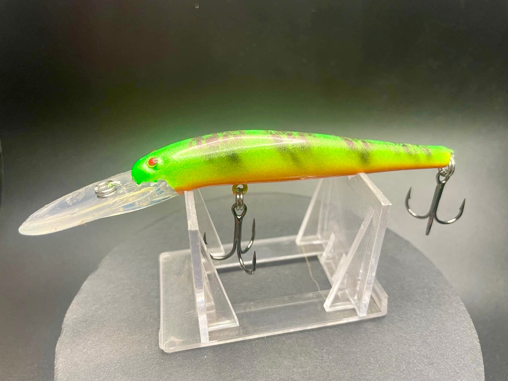 Tiger Kang Lightningstick UV Glow lure in neon green with orange belly and treble hooks