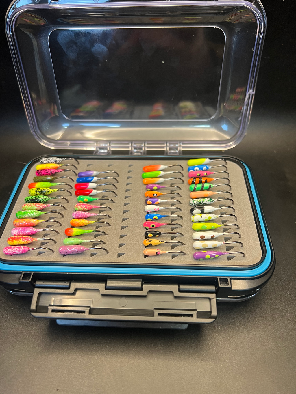Open RMA double-sided jig box with colorful tube jigs on Voodoo hooks