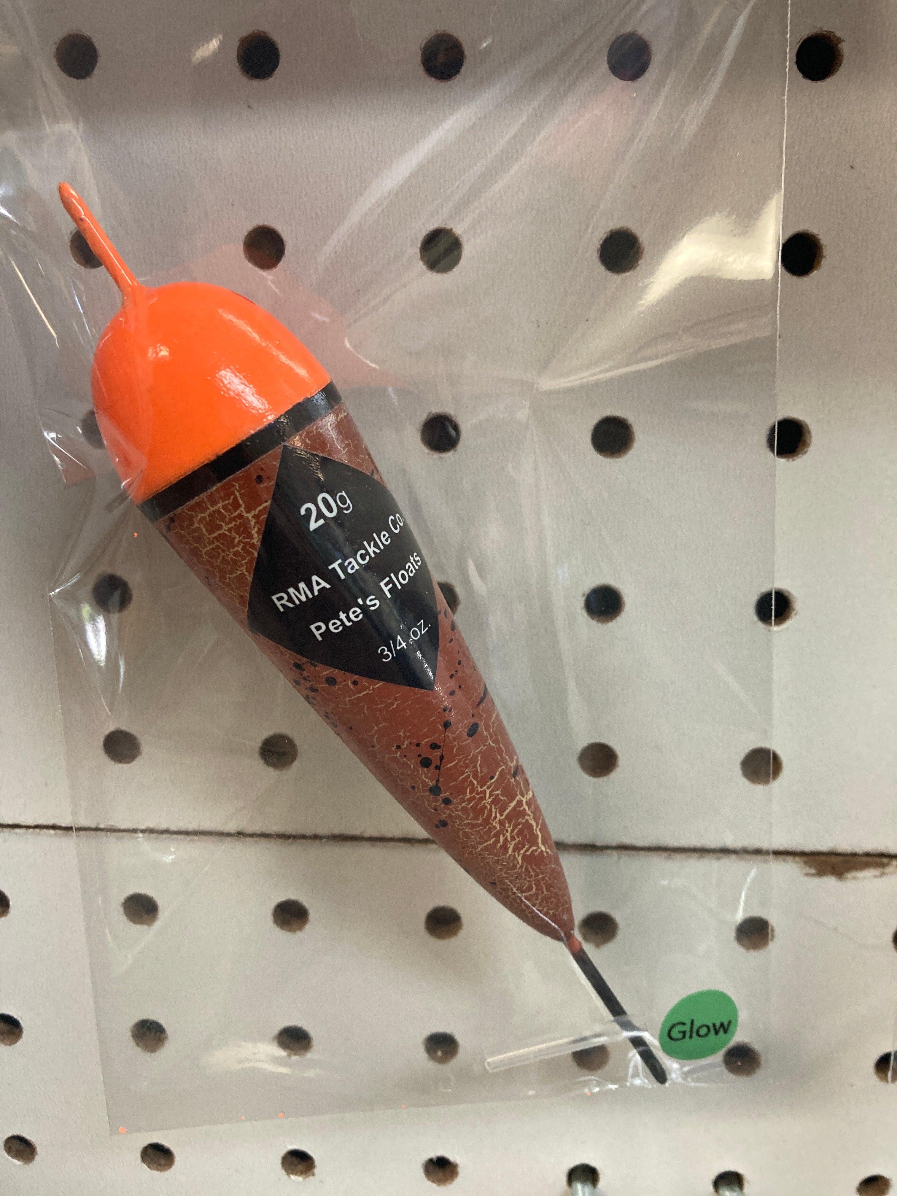 Fishing float in clear bag, orange cap with black band, brown body, 12g
