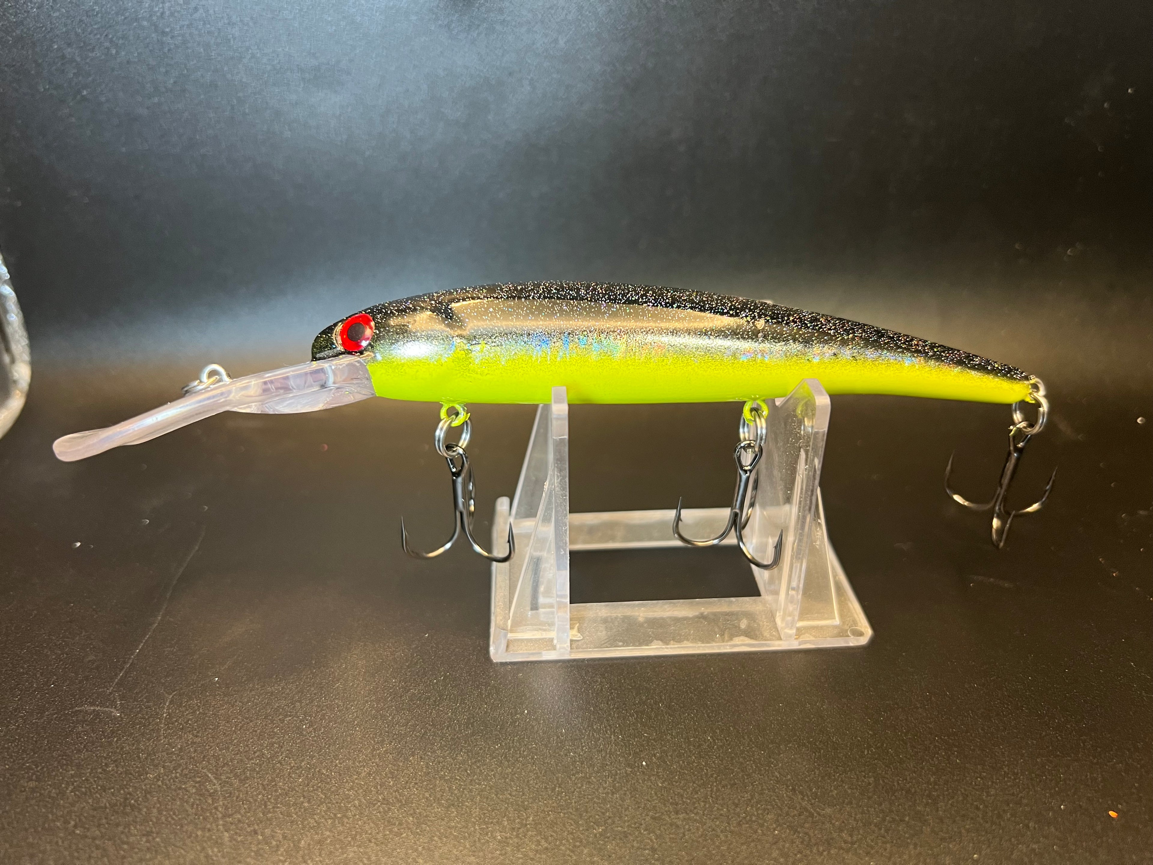 Steelie Dan UV Banned-It walleye trolling lure, neon green body with clear lip
