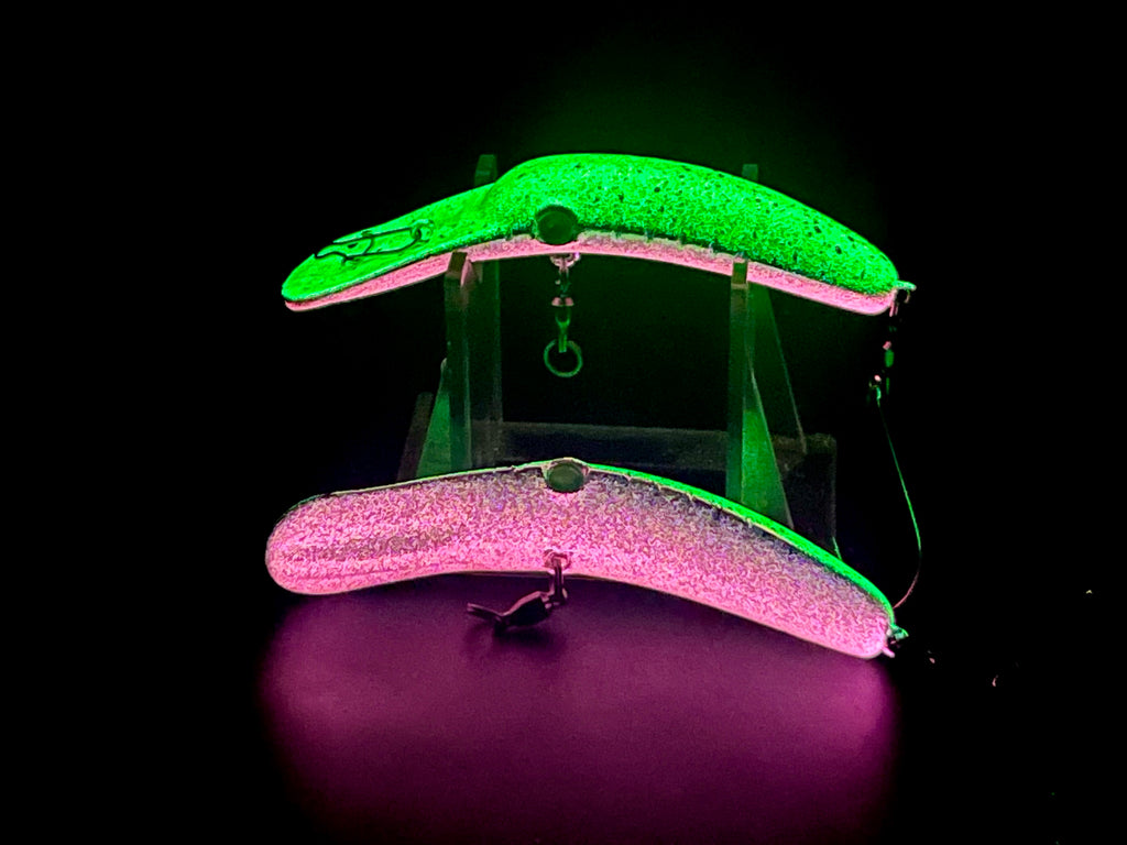 Crankbait lure with green top, pink body, single siwash hook. glow in the dark