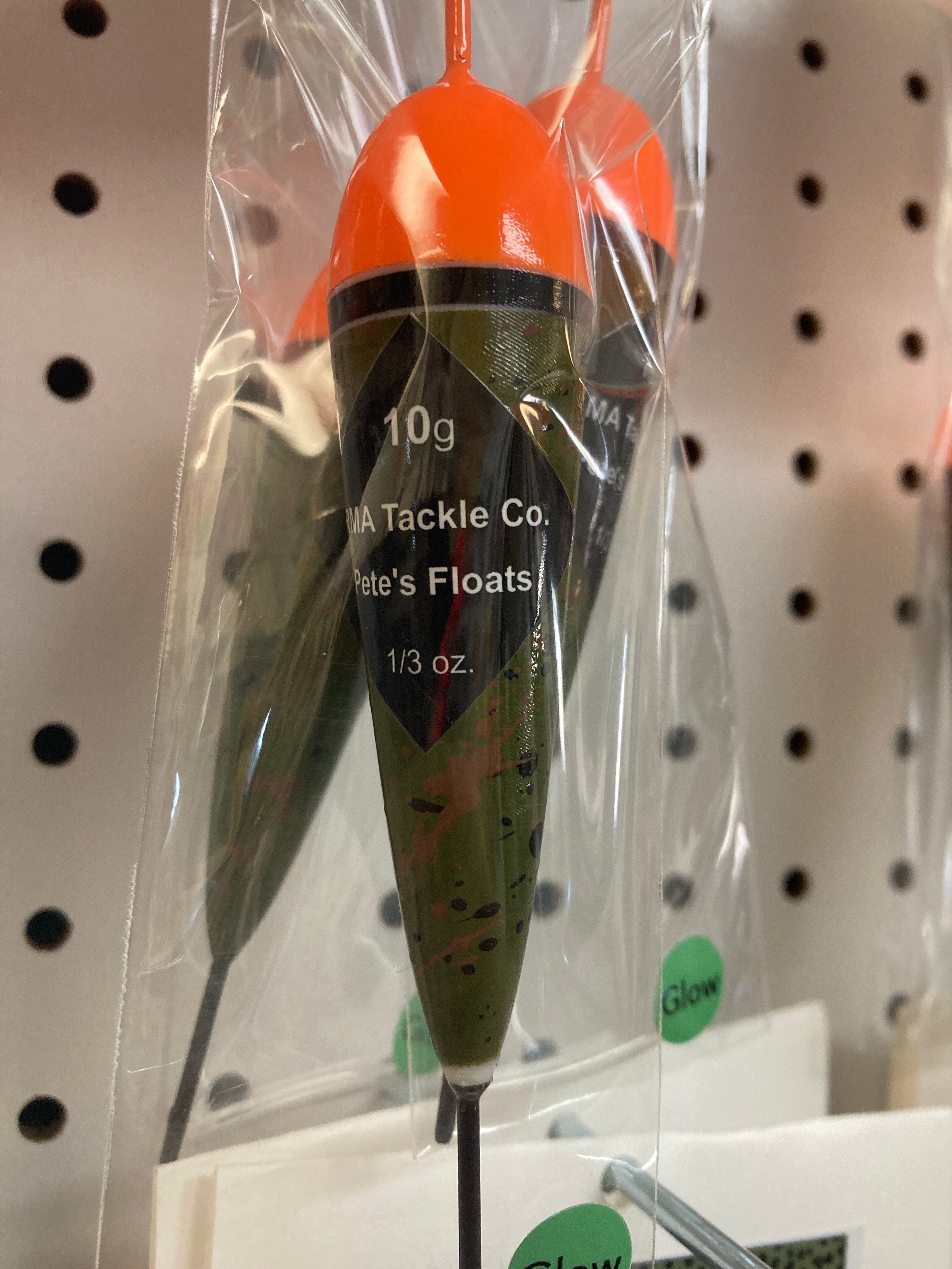 Fishing float in clear bag, orange cap with black band, green body, 10g