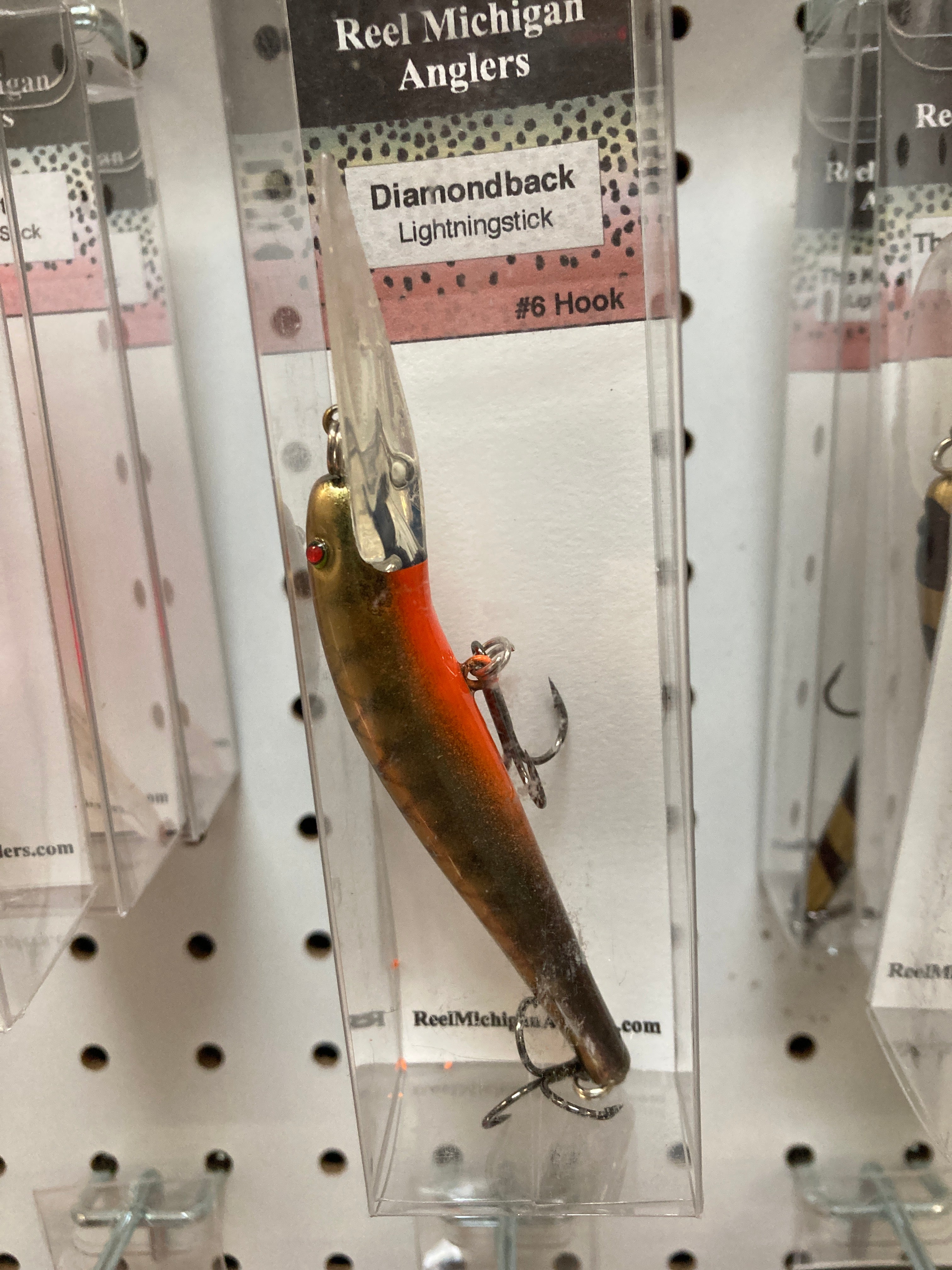 Gold and orange gradient fishing lure with #6 hook and treble hooks.