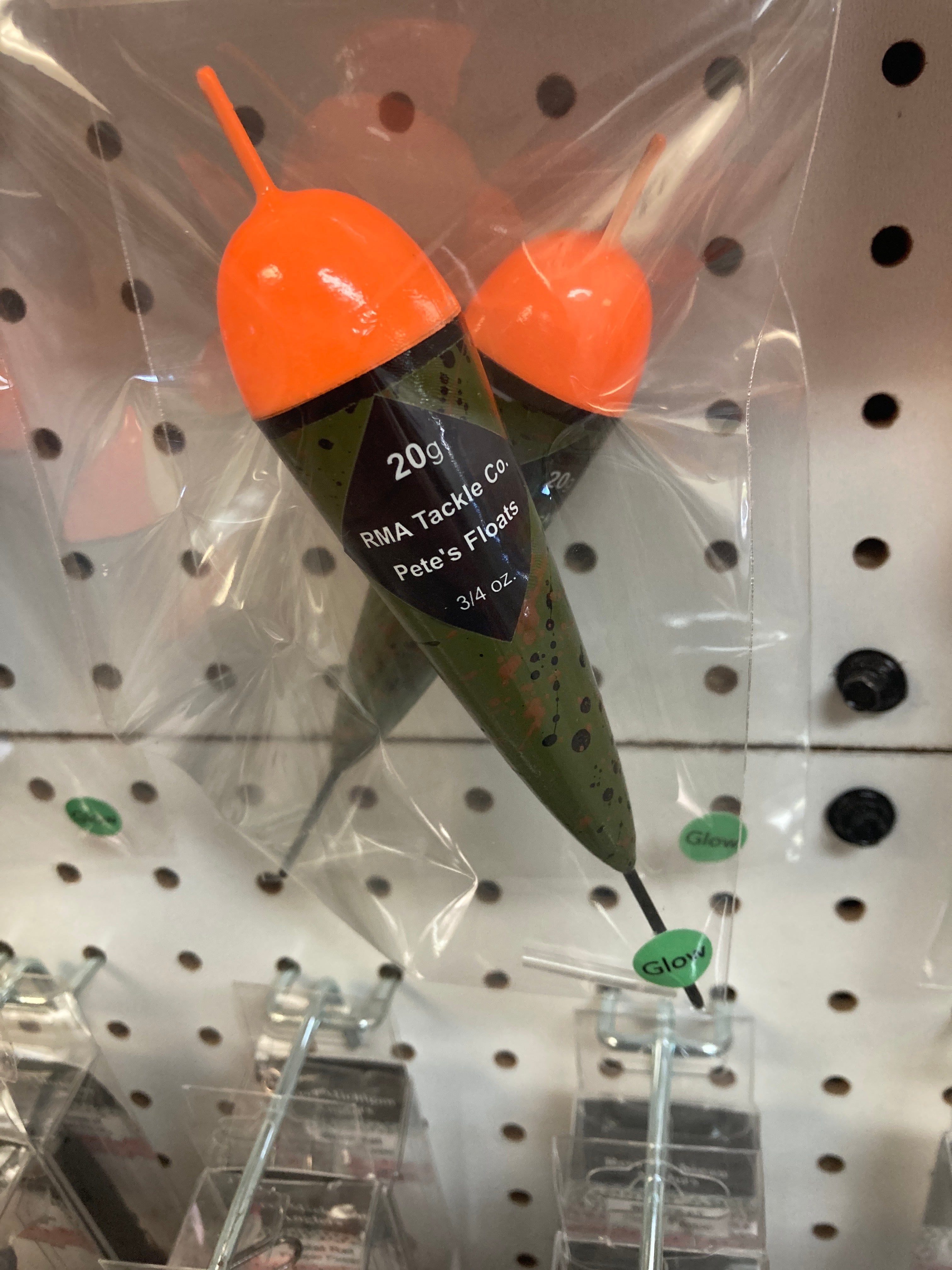 Glow-in-the-dark fixed fishing float, orange top and green body with bag packaging
