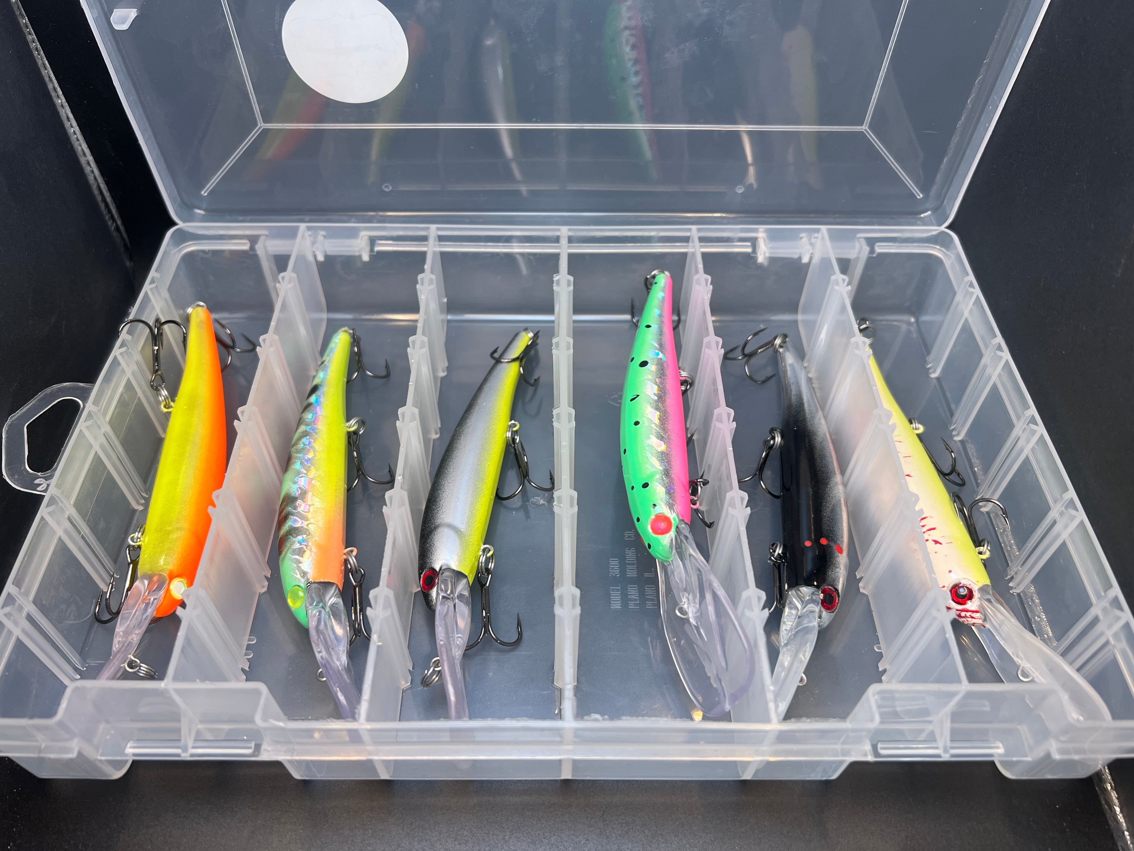 Banned It Box tackle organizer with multiple fishing lures in bright colors