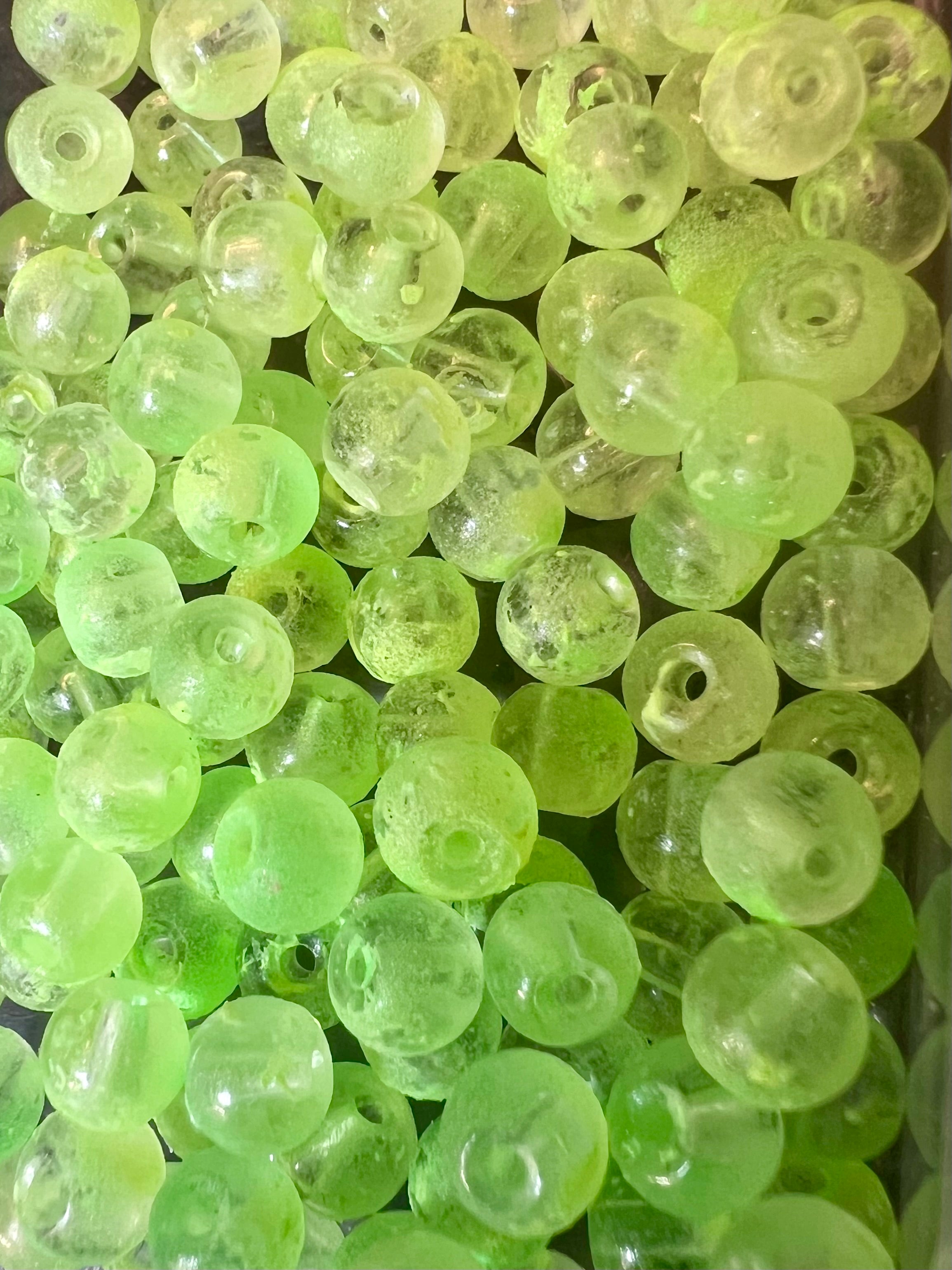 Neon green UV glow glass fishing beads, round with central holes