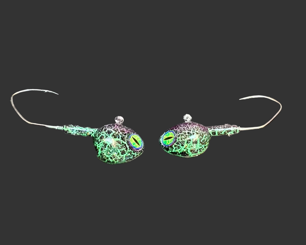 Chameleon UV walleye jigs: two green iridescent heads with chartreuse UV skirts and hooks