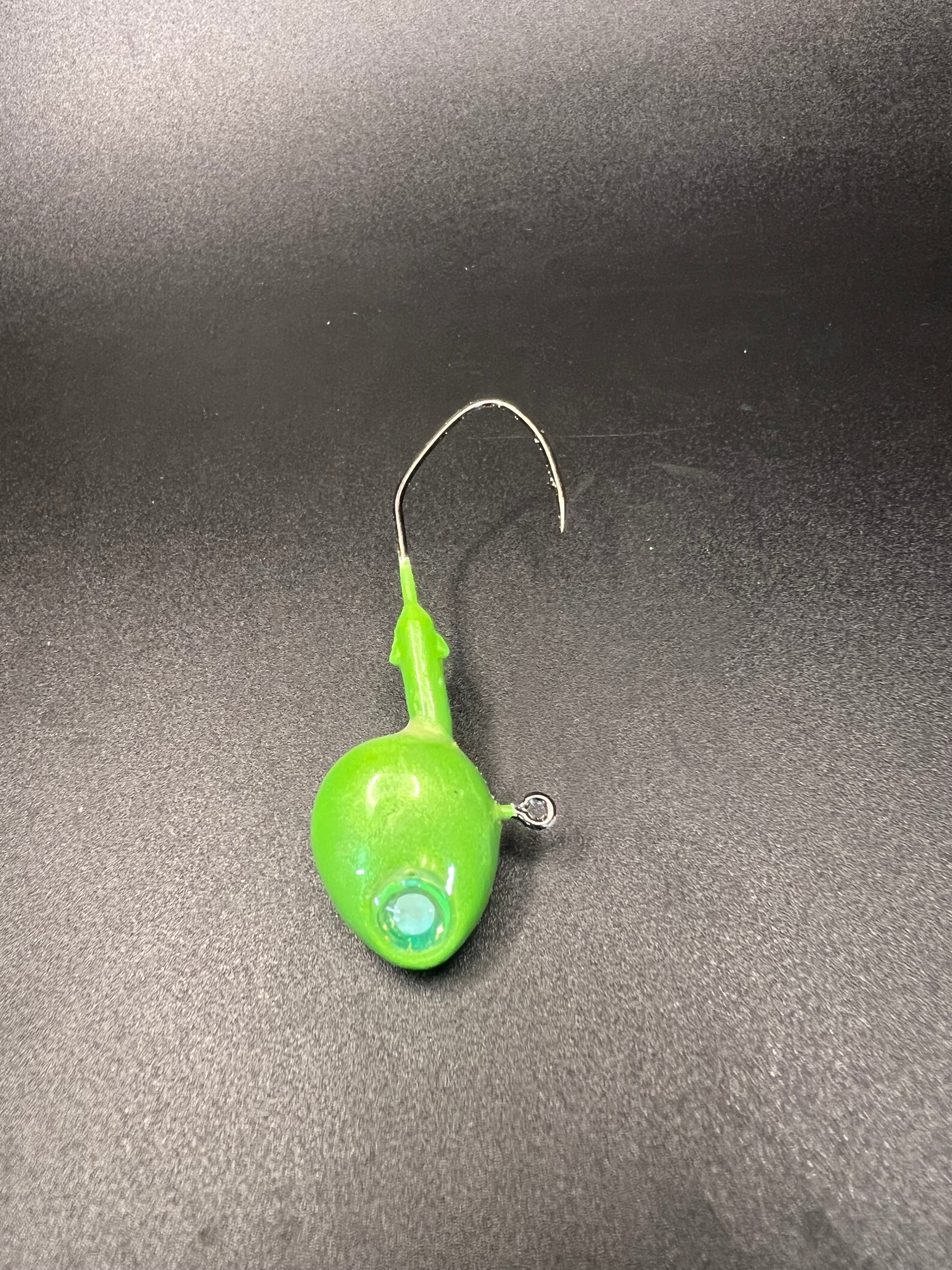 Green walleye jig with clear eye, round head, arched hook and split ring