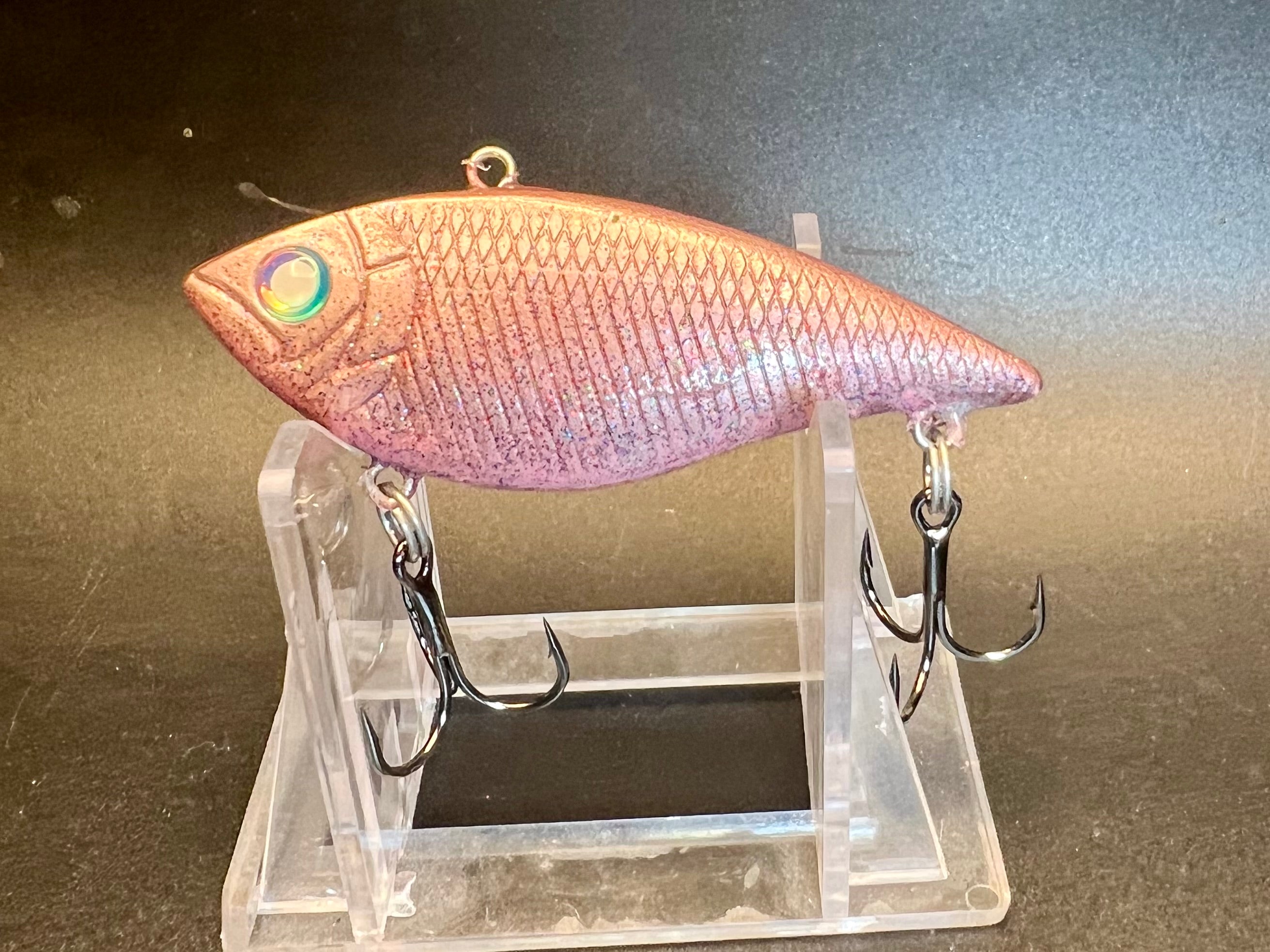 Pink Glitter Trap fishing lure, pink glitter body with front eye and two treble hooks