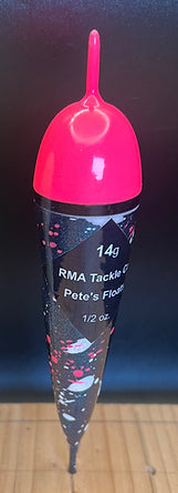 Glow-in-the-dark fixed fishing float, pink top and dark blue speckled body in bag