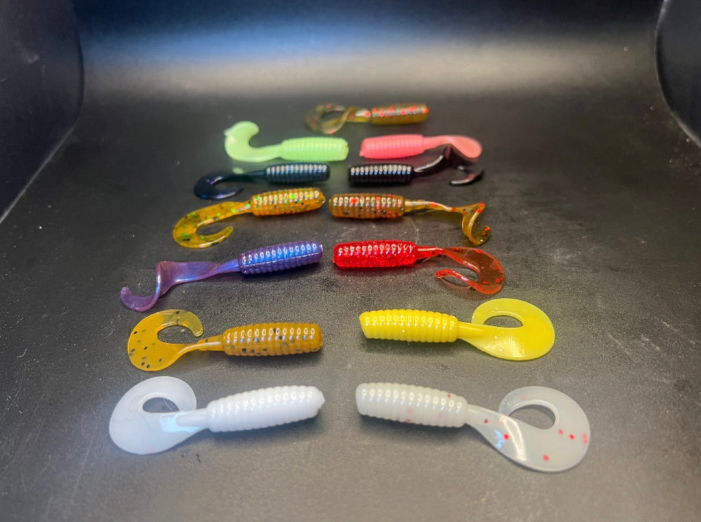 Curly Twister tail grubs in assorted colors: green, purple, red, yellow, white, dark/blue