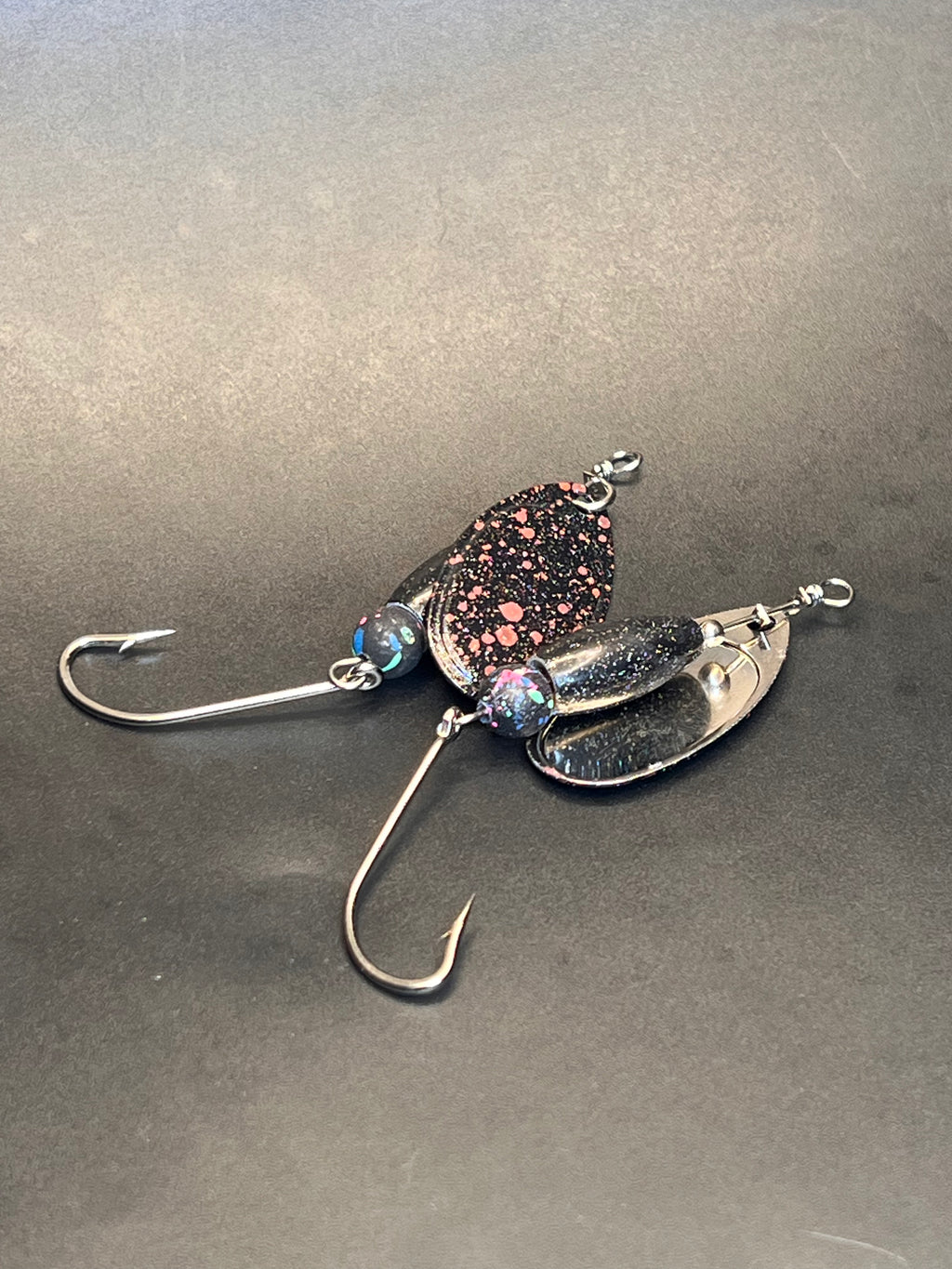 Chrome inline spinner with dark glitter body and single treble hook