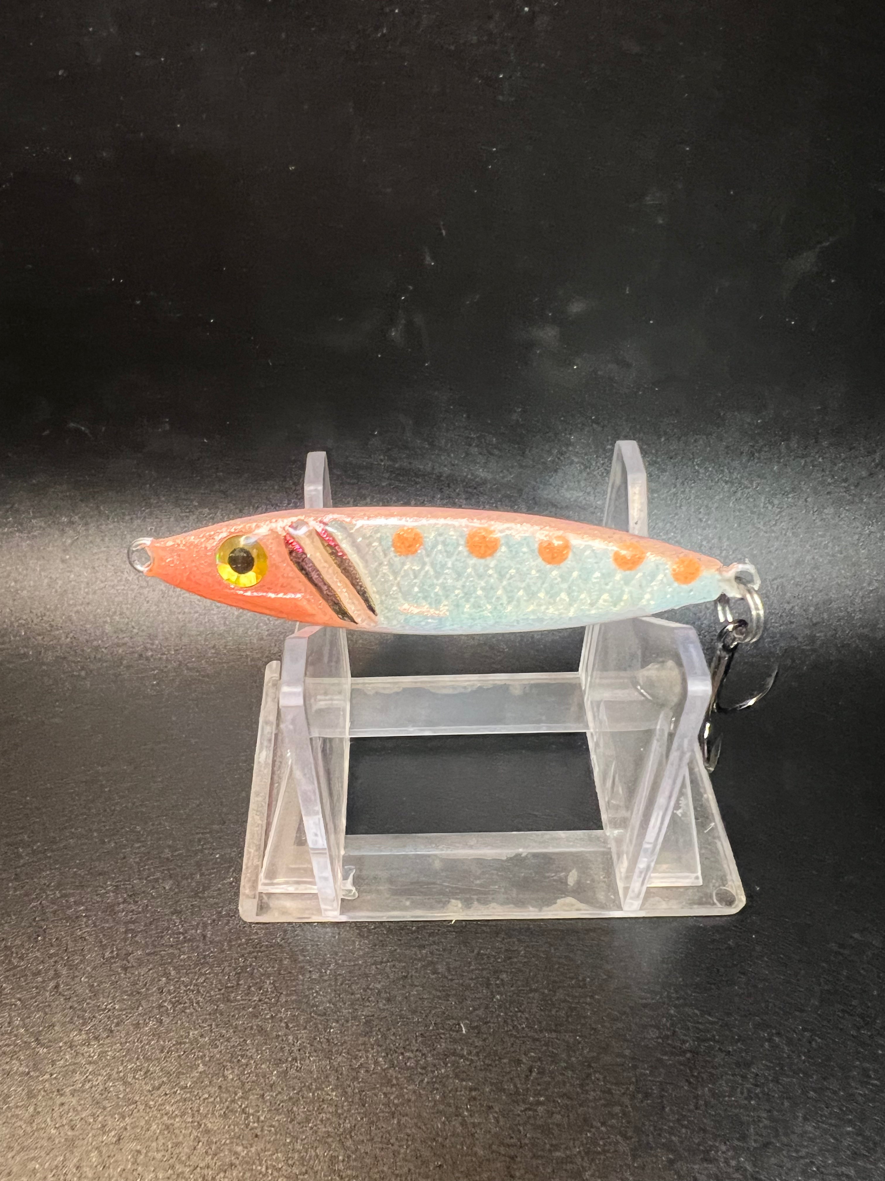 3/4 oz jigging spoon, orange-and-white with chartreuse eye and orange dots