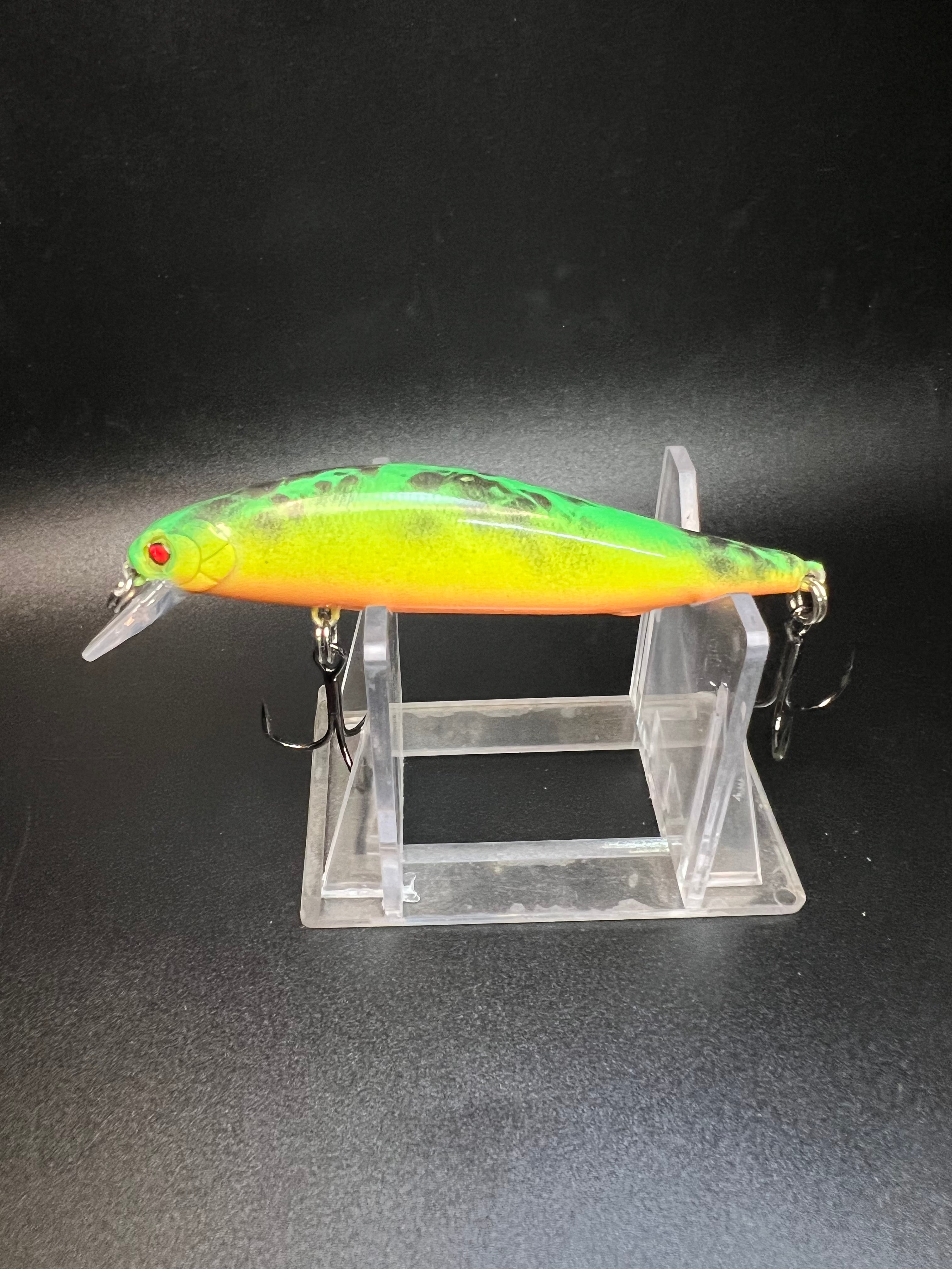 3.5 in jerk bait in tiger pattern, green back with orange body and two hooks