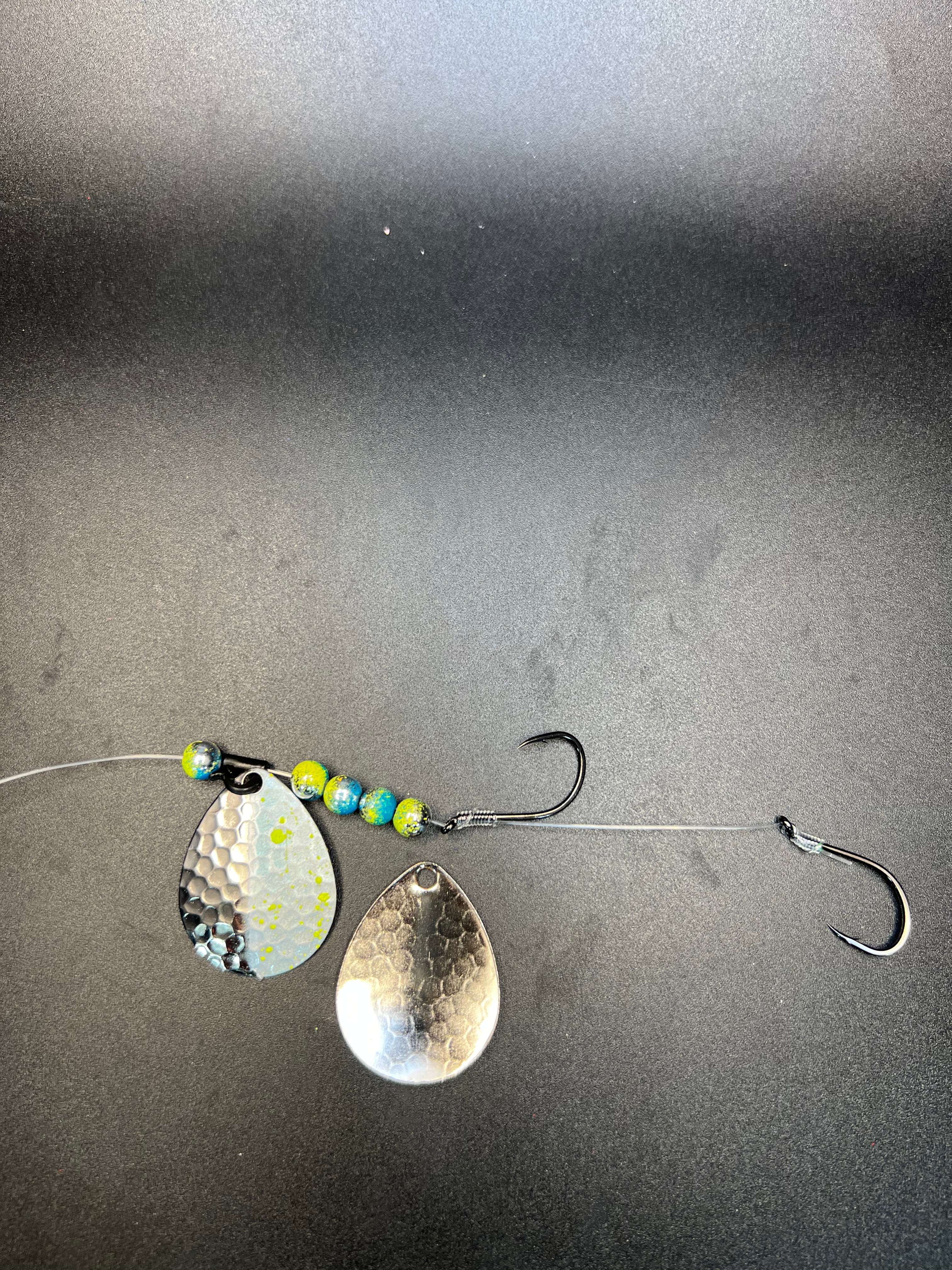 Fishing spinner blade harness with silver and gold blades and treble hooks