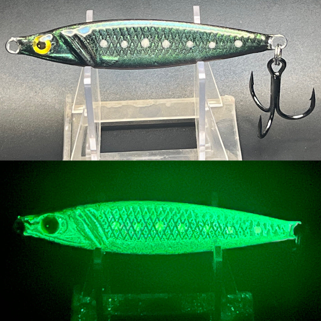 Green double-glow jigging spoon with scale pattern and treble hooks