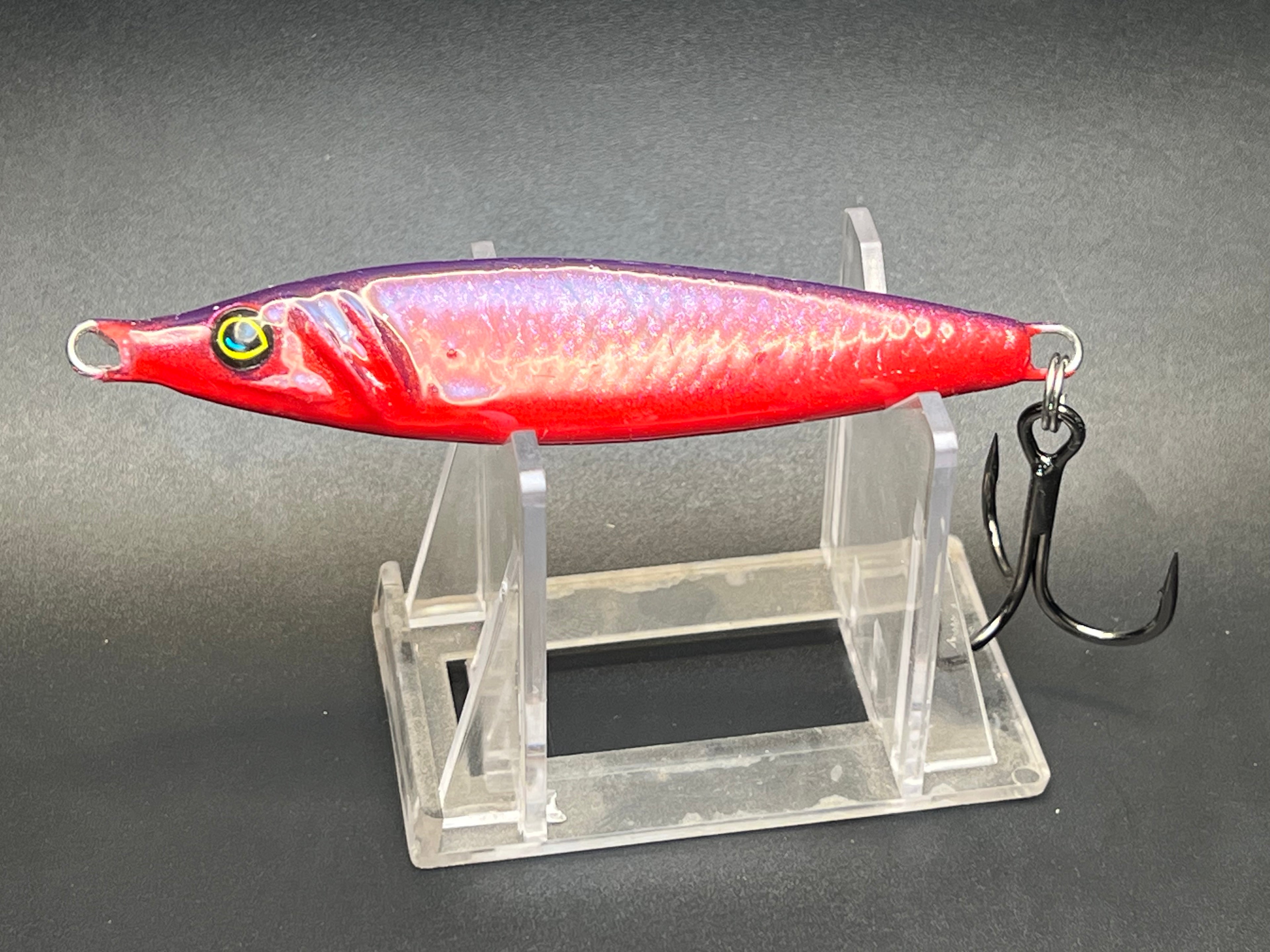 Red and purple jigging spoon with UV sheen, metal hooks and split rings