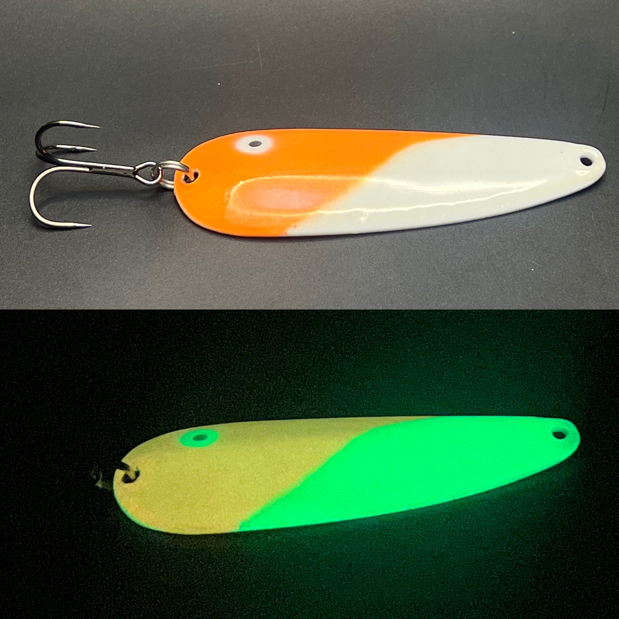Fishing casting spoon lure set with treble hooks, orange and white plus green glow.