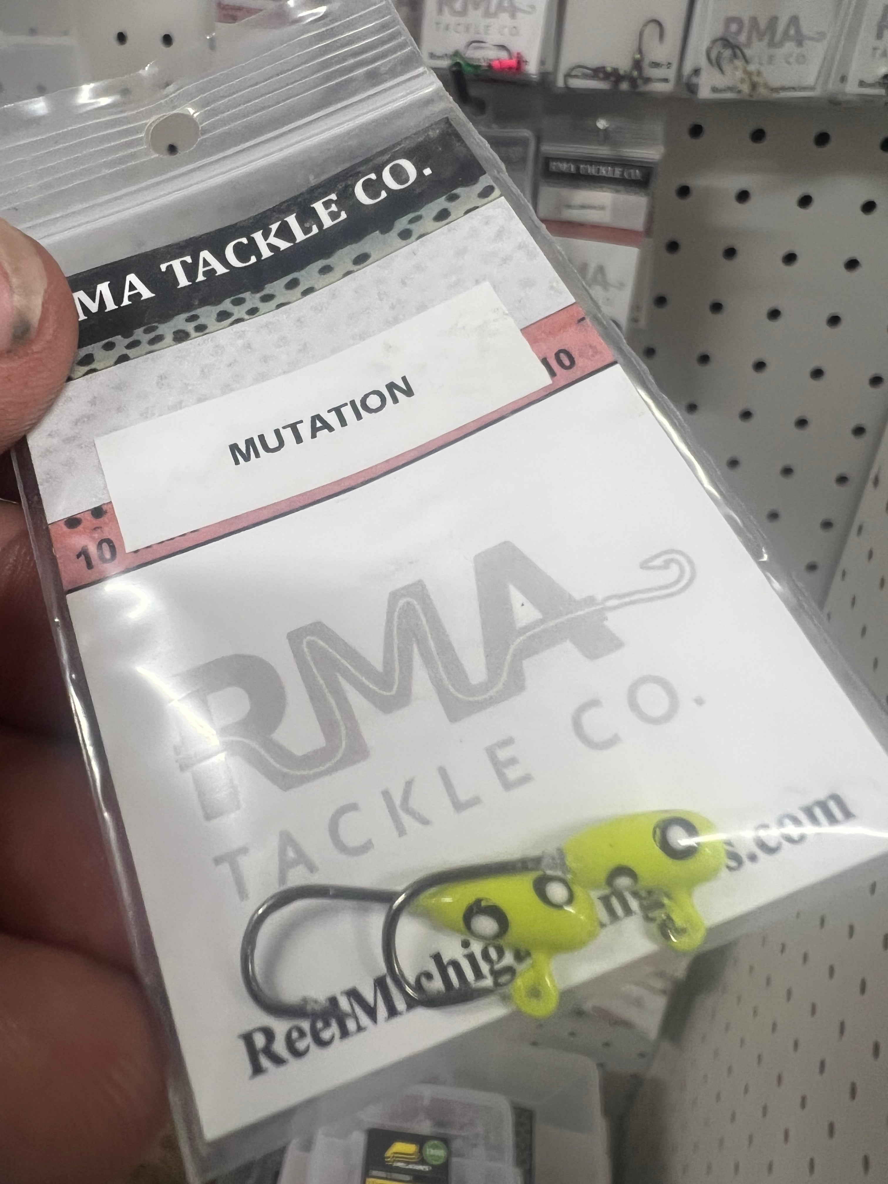 2-pack glow steelhead tube jigs with neon yellow-green hooks on retail card