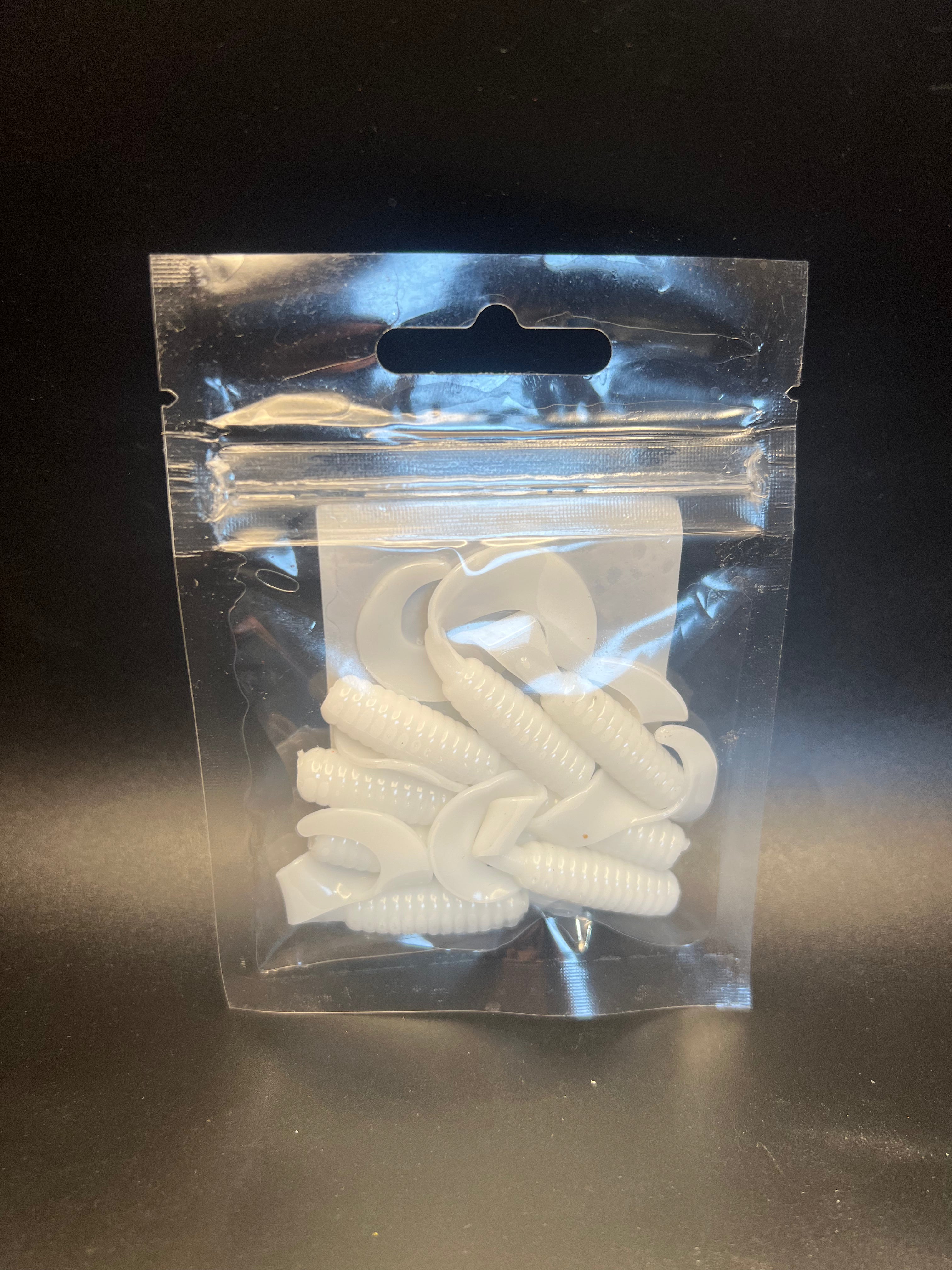 White curly twister tail grub soft plastics in clear blister bag