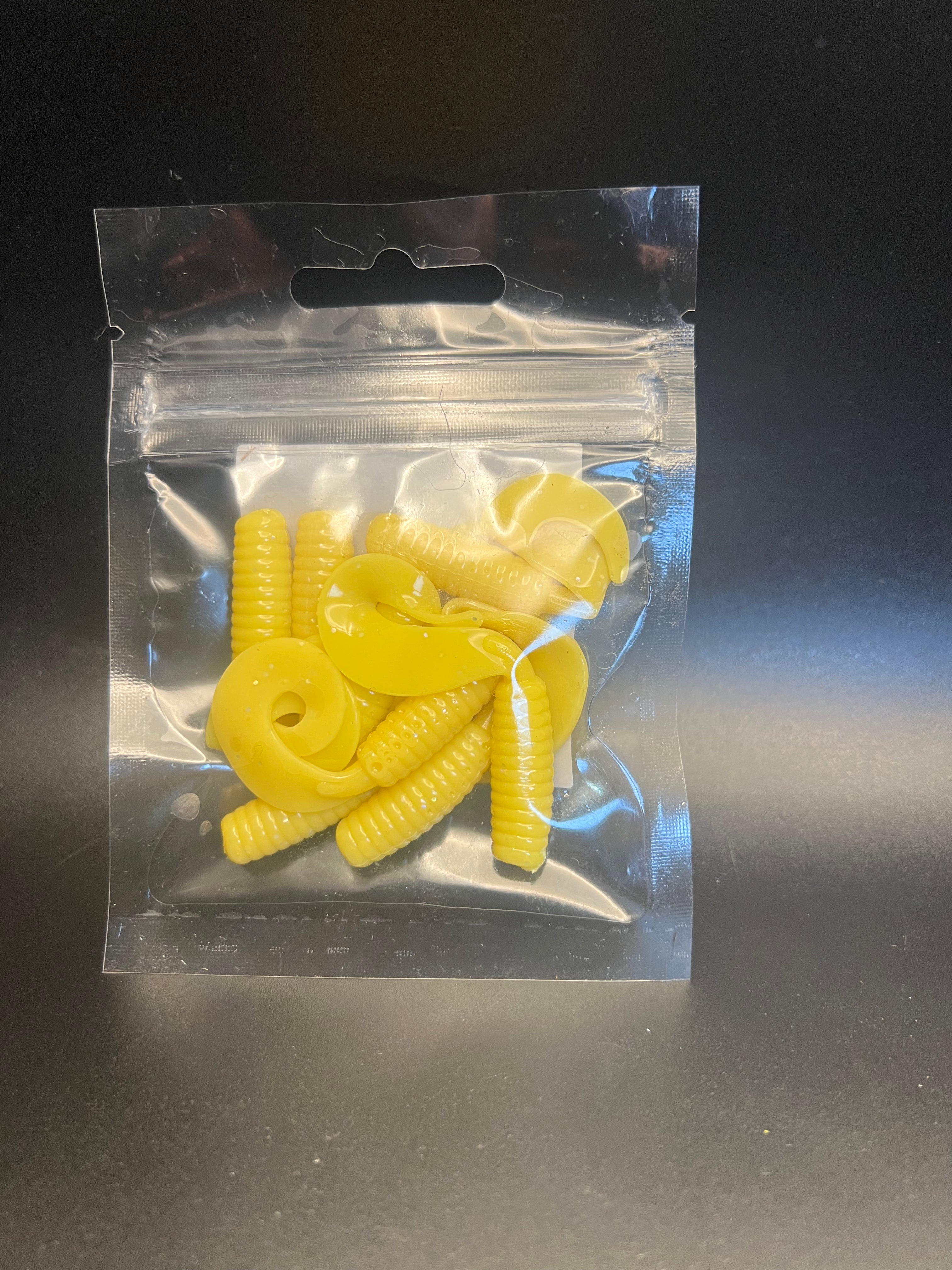 Yellow curly twister tail grub soft plastics in clear blister bag