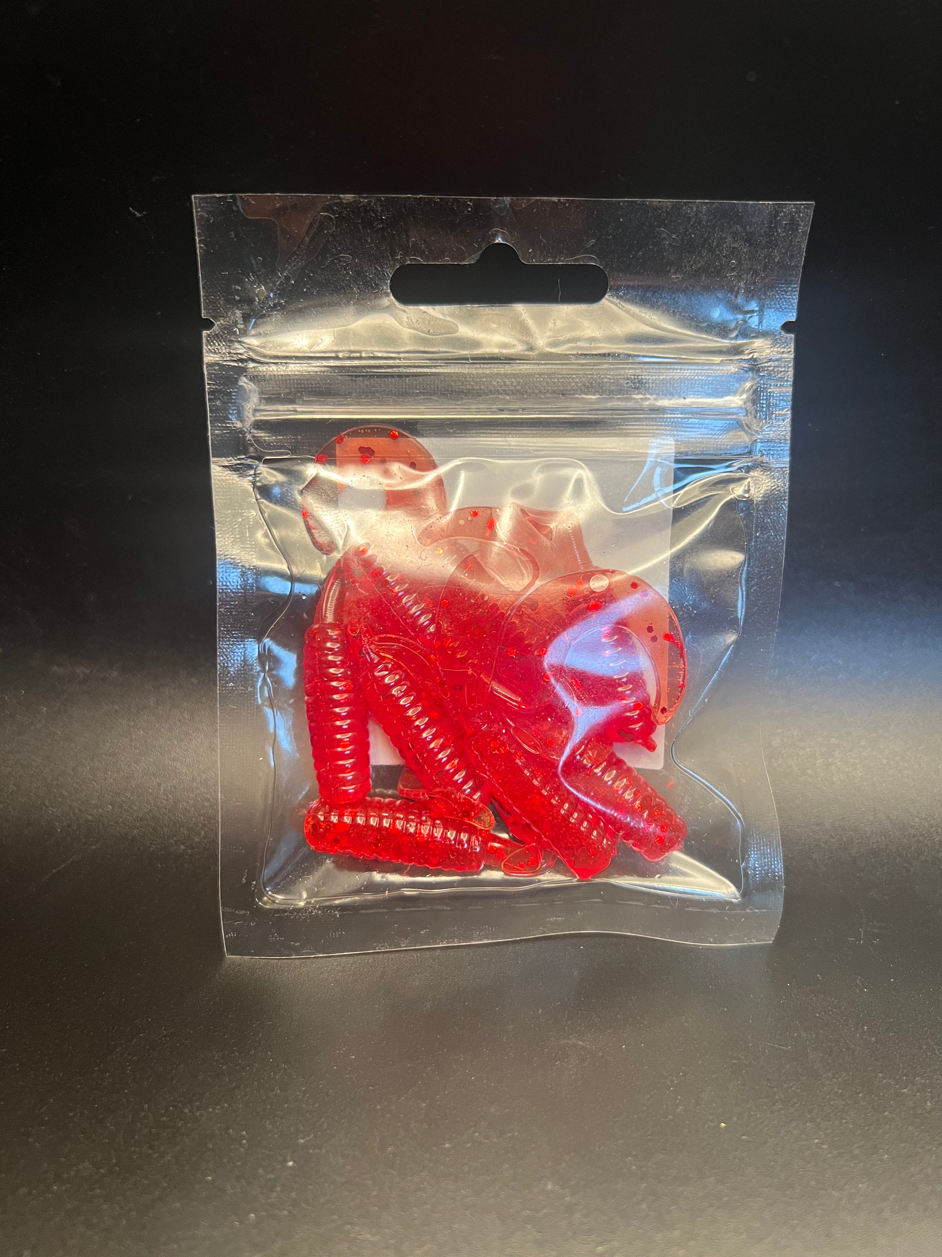 Red curly twister tail grub soft plastics in clear blister bag