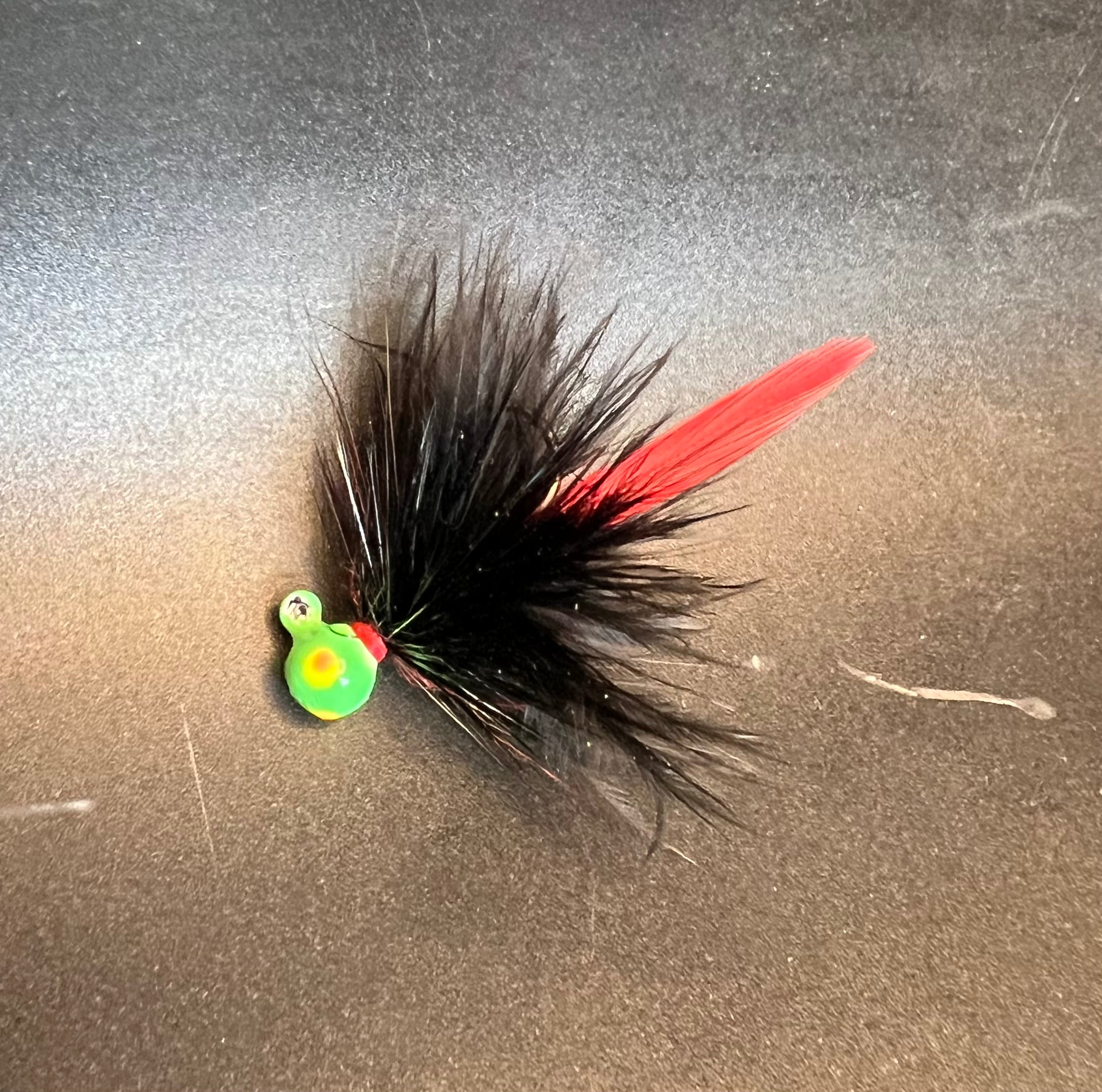 Biohazard UV glow Steelhead hair jig with #4 hook by RMA Tackle Co, featuring vibrant colors and detailed feathered design.