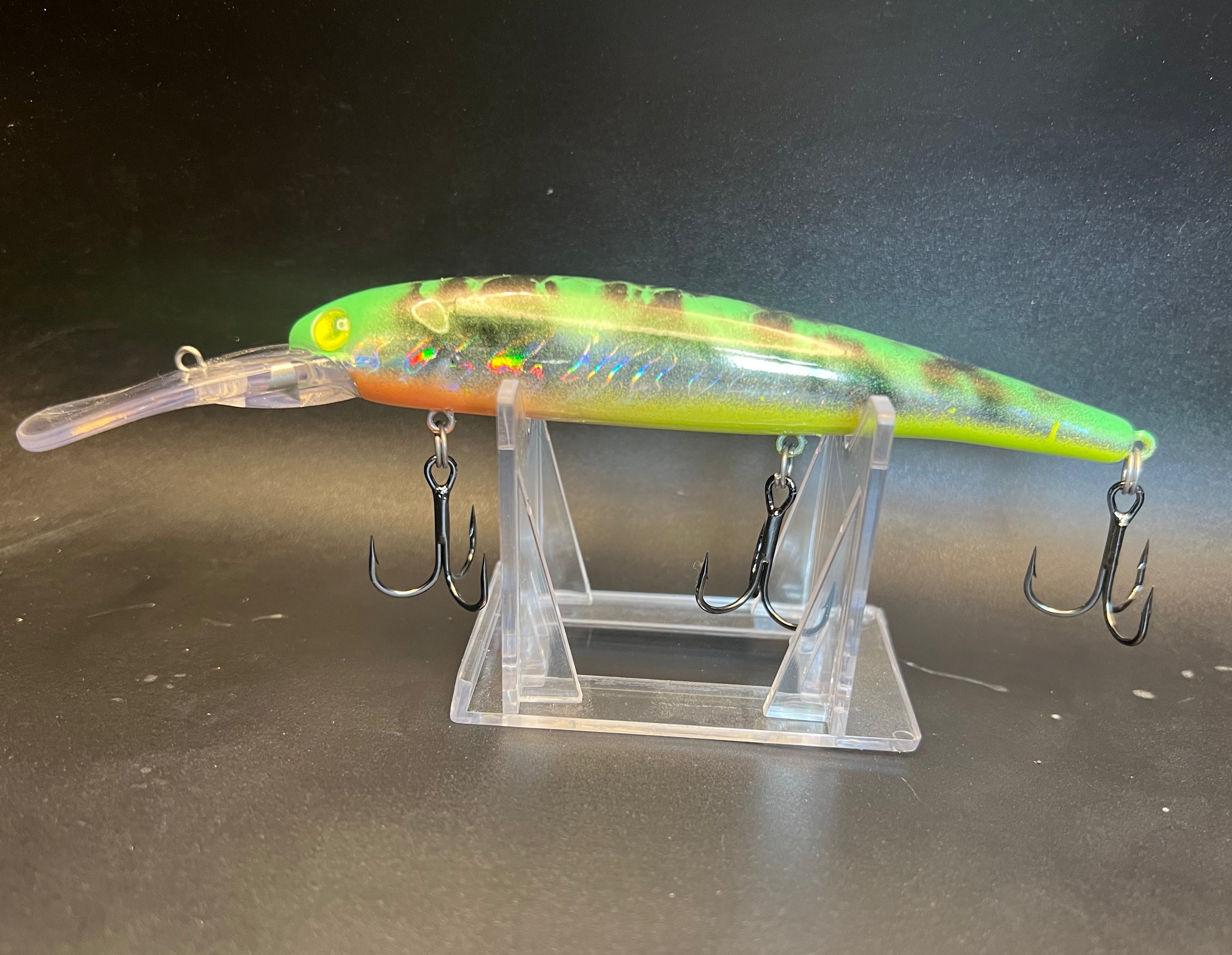 UV-Walleye Trolling Lure, green chartreuse with two treble hooks on clear stand