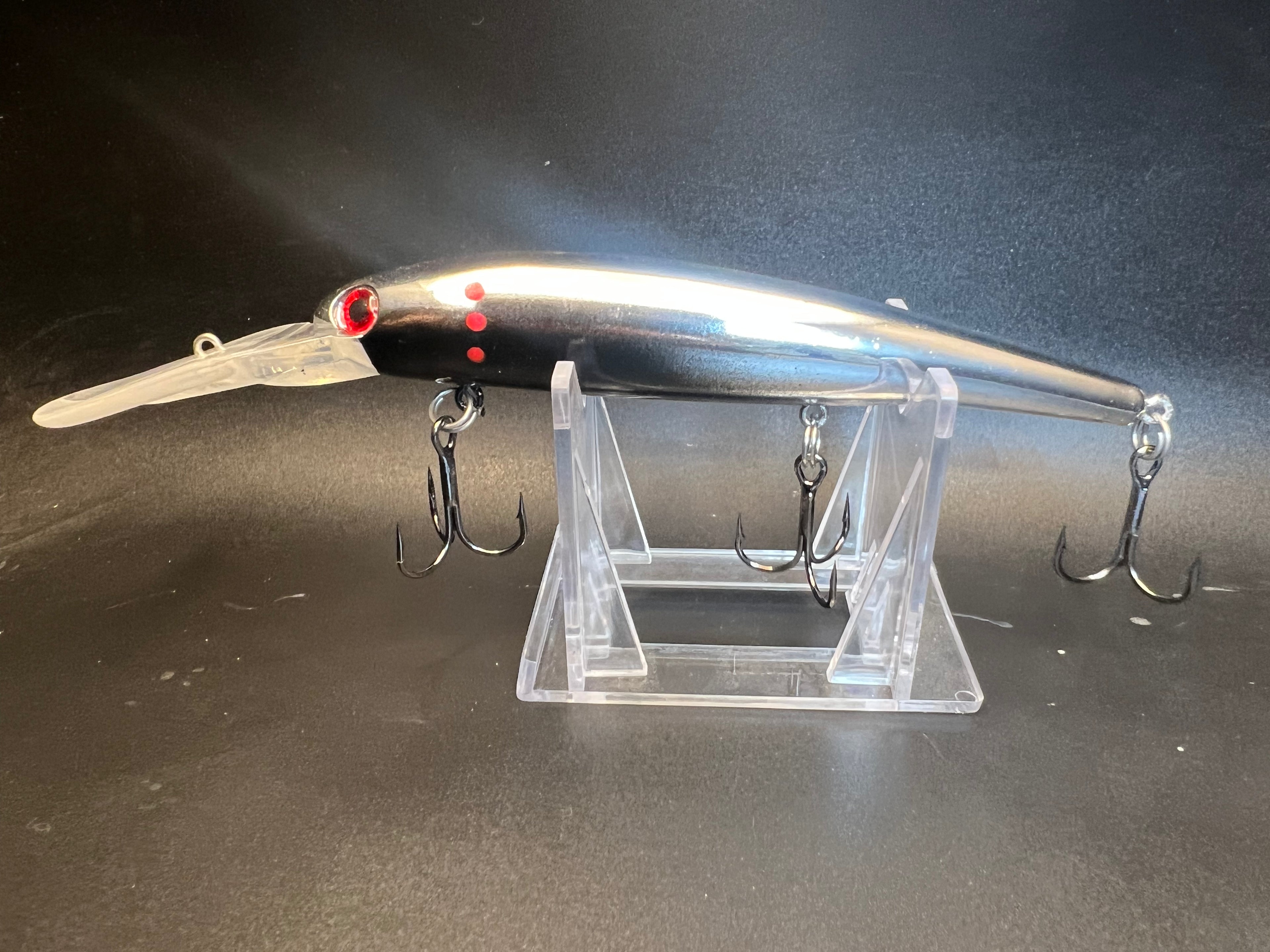 Quicksilver UV trolling lure in minnow shape, black/silver with red eye and treble hooks