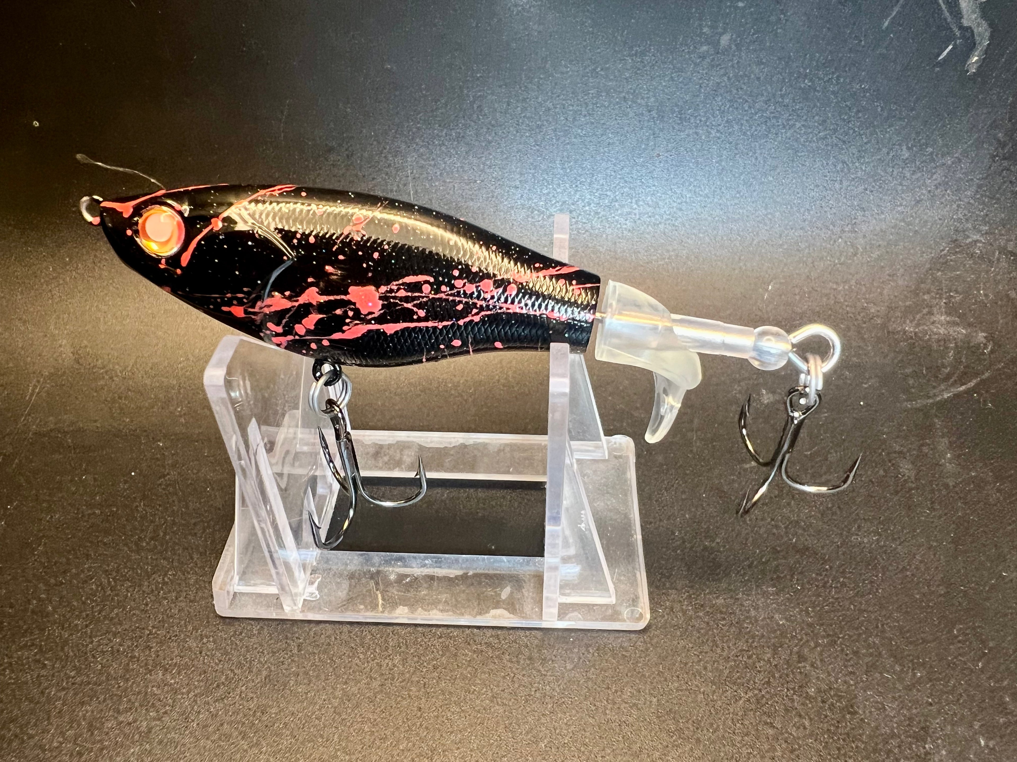 Slamin Salmon Flopper 90mm flat-side popper lure, black with pink/red speckle, clear lip and treble hooks