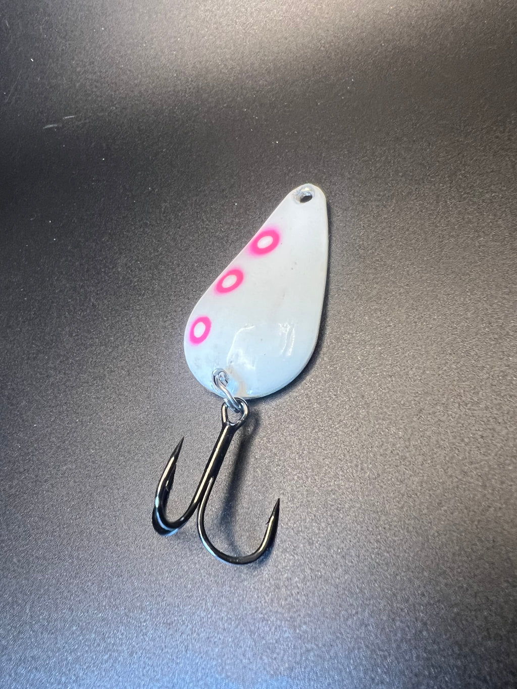 Radioactive Glow TJ Bobbler, light blue spoon lure with pink dots and treble hooks