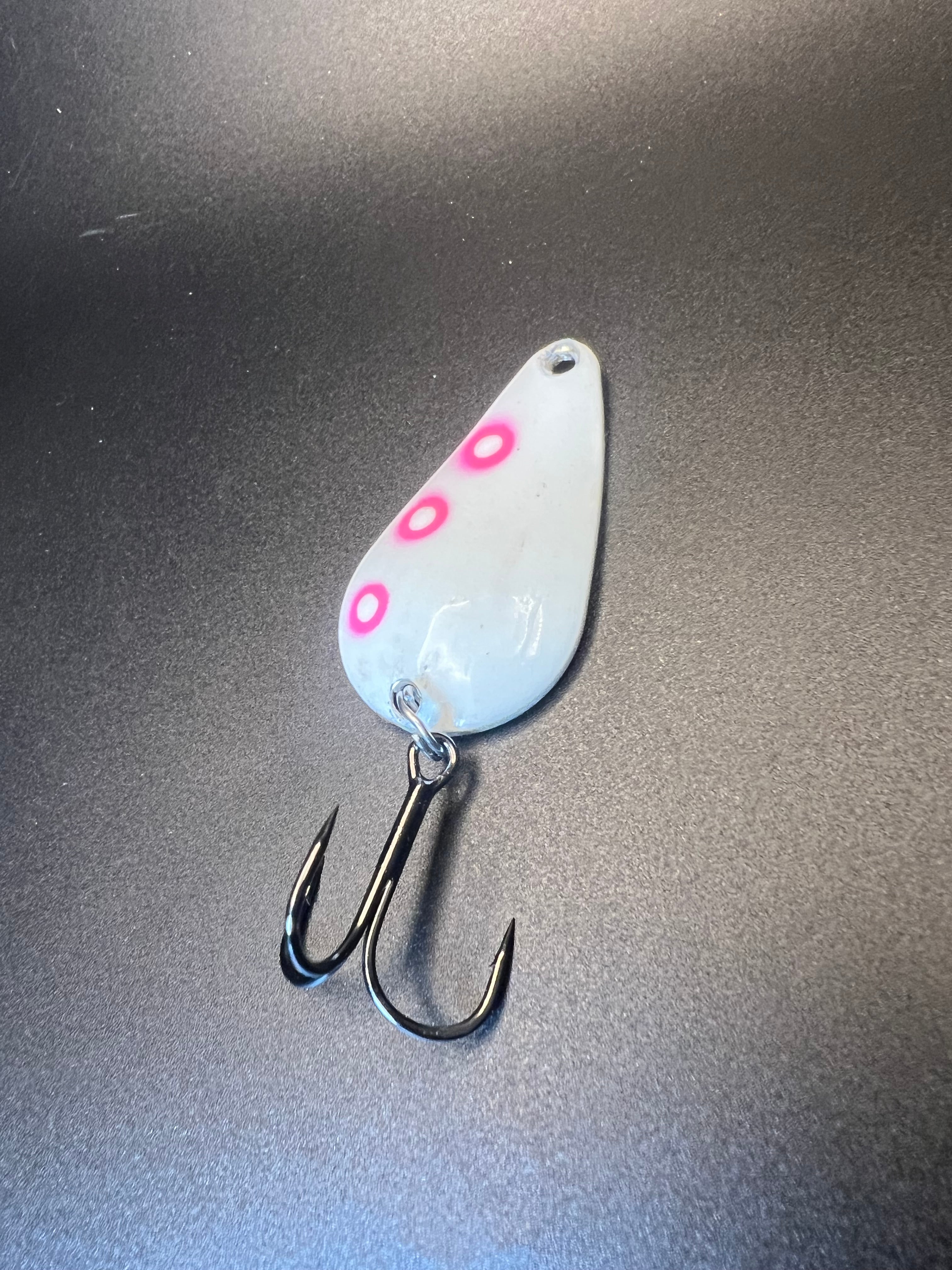 Radioactive Glow TJ Bobbler, light blue spoon lure with pink dots and treble hooks