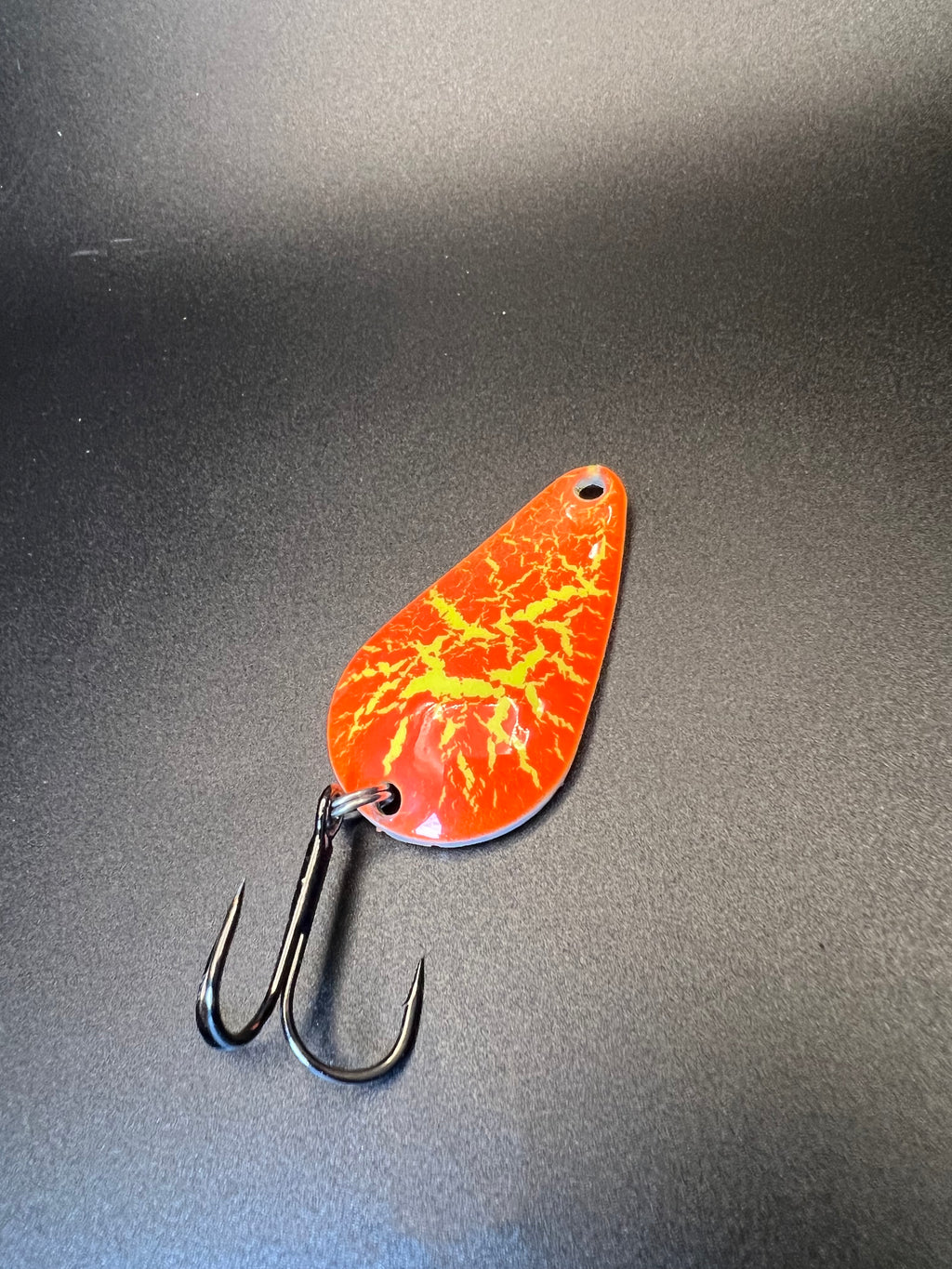 Yellow Crack Super Glow TJ Bobbler lure in orange-yellow crack pattern with treble hooks