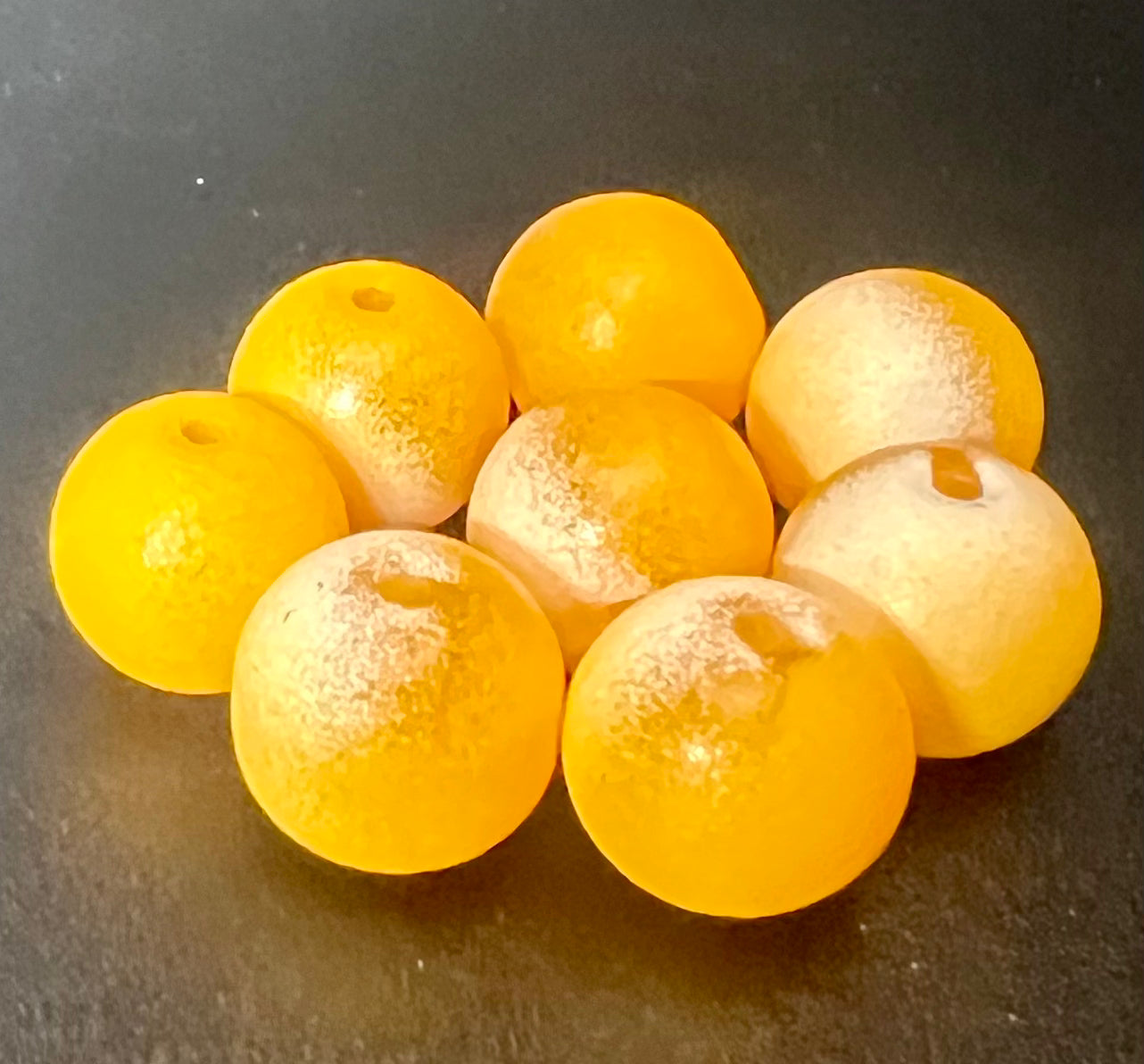 Spawn Connery glass steelhead fishing beads in yellow and translucent shades