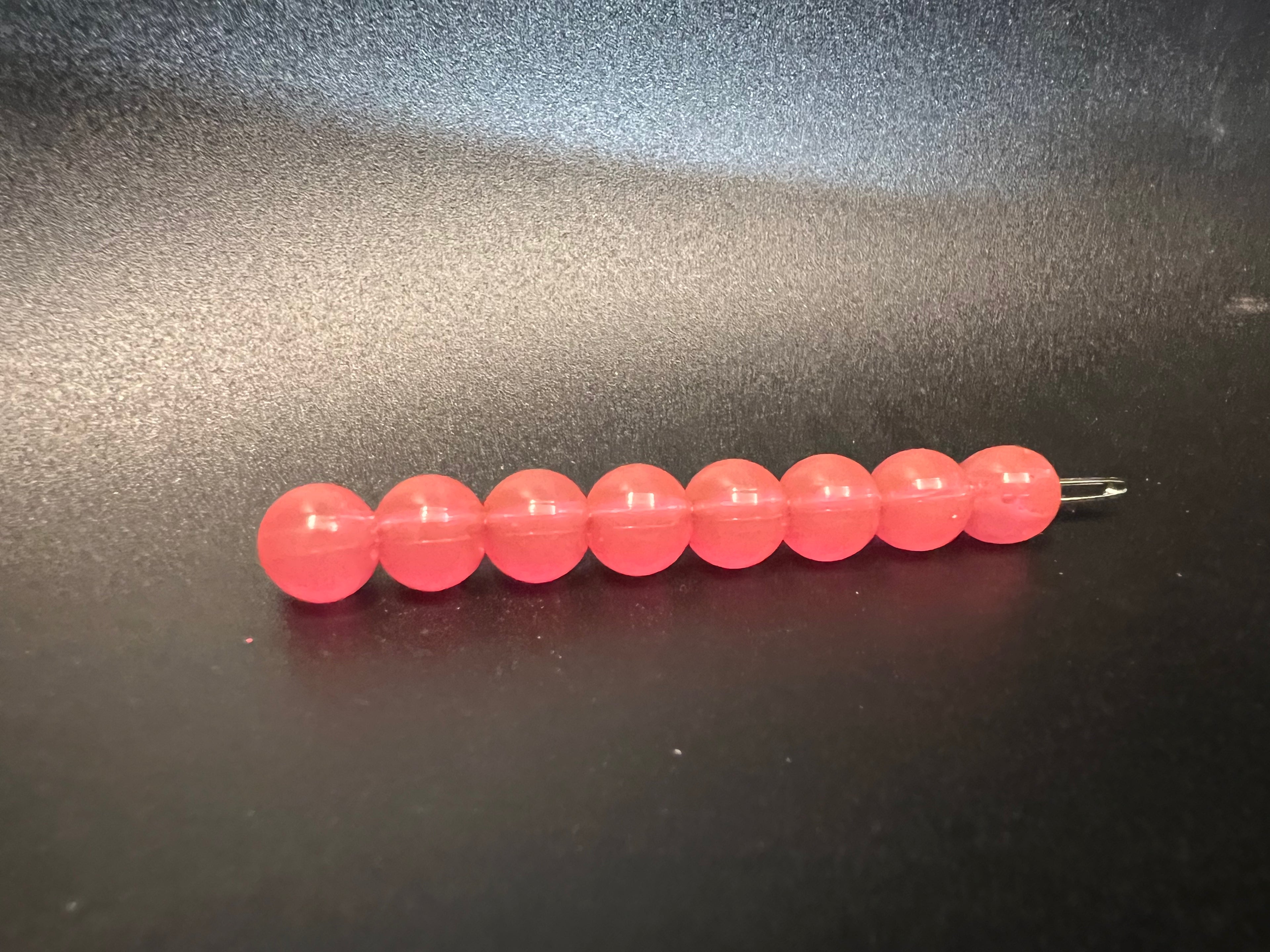 Hot Shot soft plastic beads, pink-coral, on wire strand with pin/eye