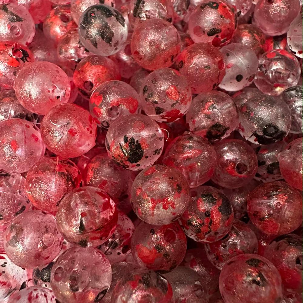 UV-glow plastic fishing beads, red with black speckles
