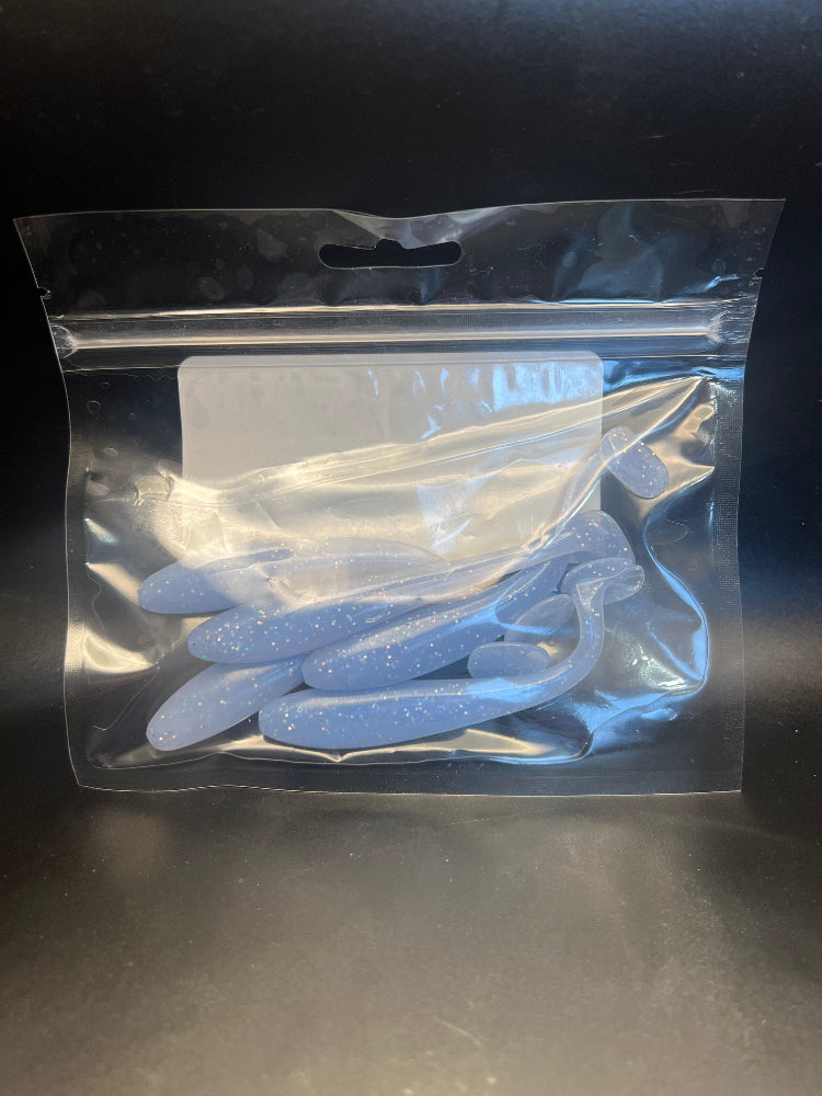 Light blue speckled paddle tail swimbaits in retail bag