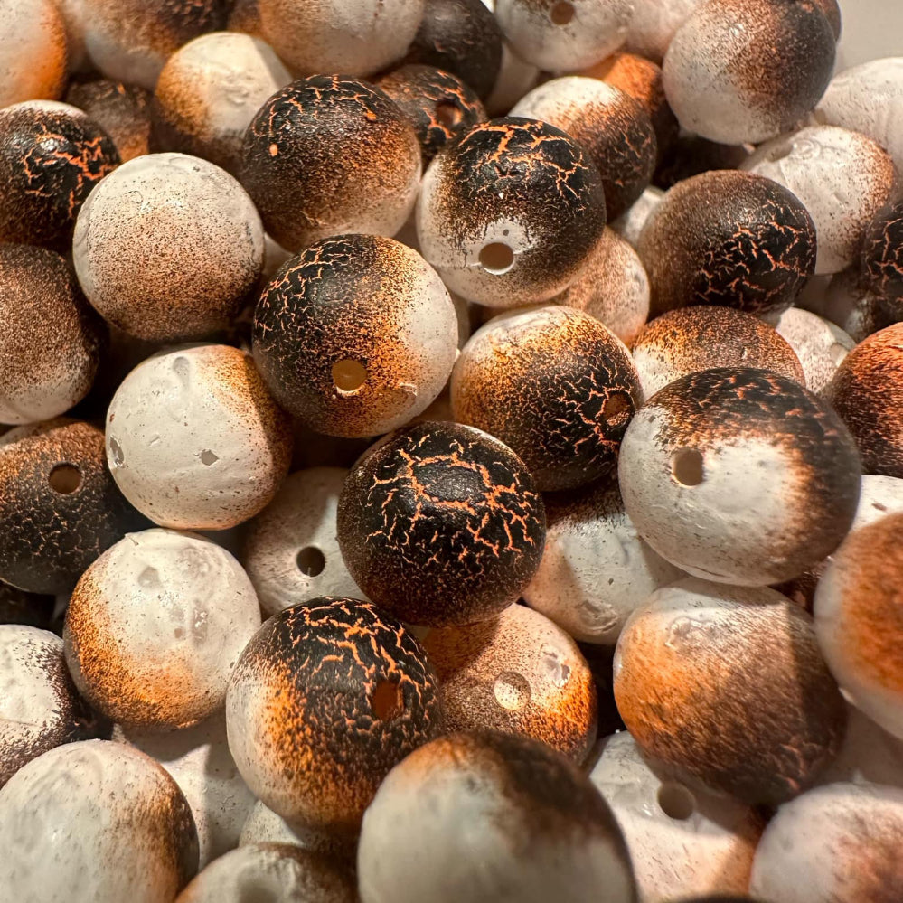 Toasted marshmallow UV glow fishing beads in bronze and dark brown with holes