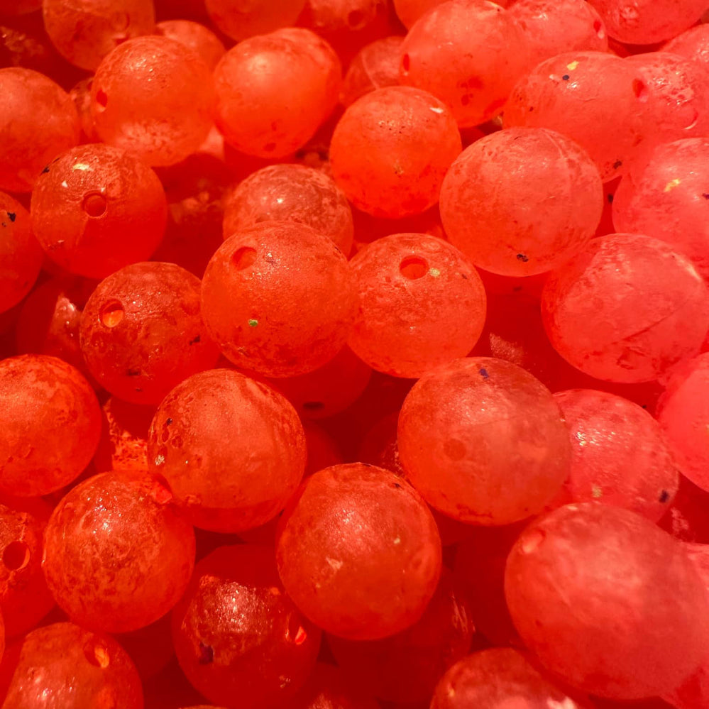 Eggscalibur UV Glow fishing beads, orange translucent plastic spheres