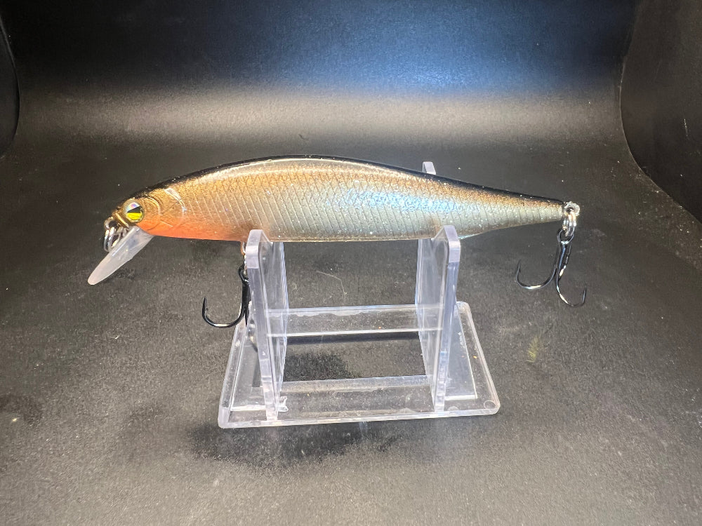 Gold Rush Clickbait 4.25in jerkbait in gold/orange with two treble hooks