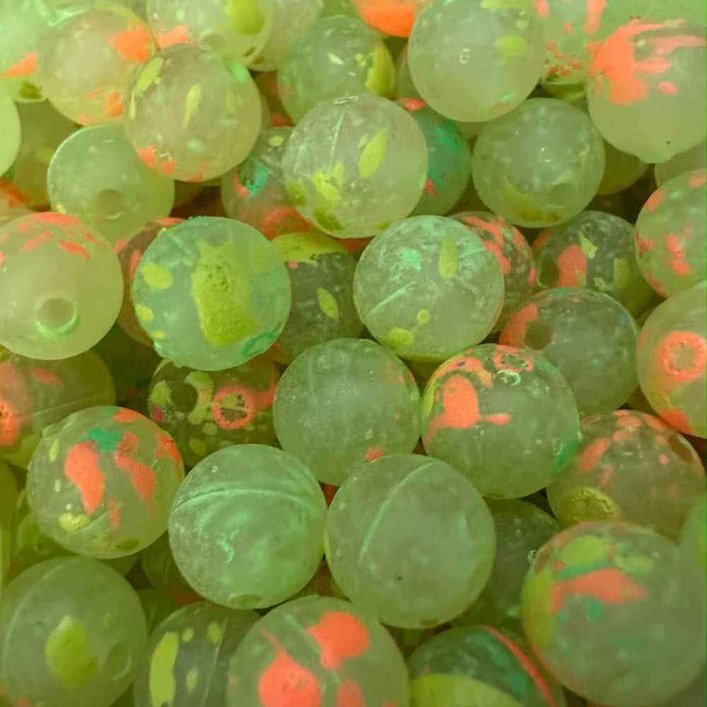 UV-glow fishing beads, translucent light green with orange speckles
