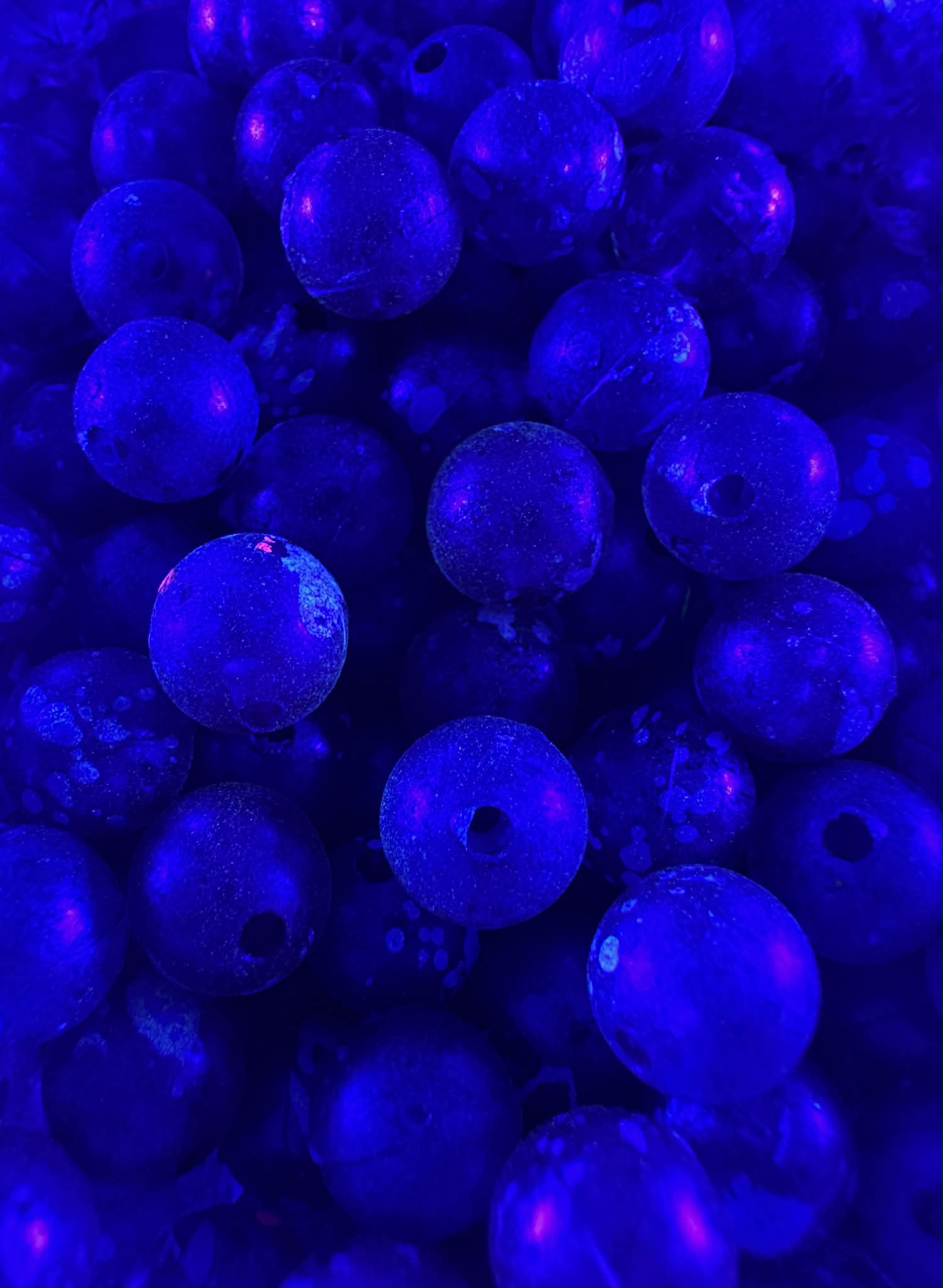 Winterberry UV glow fishing beads, blue plastic spheres with center holes