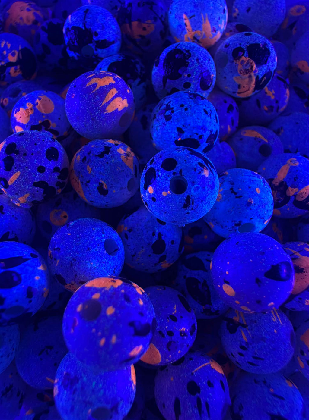 UV glow blue fishing beads with speckled pattern and round center holes