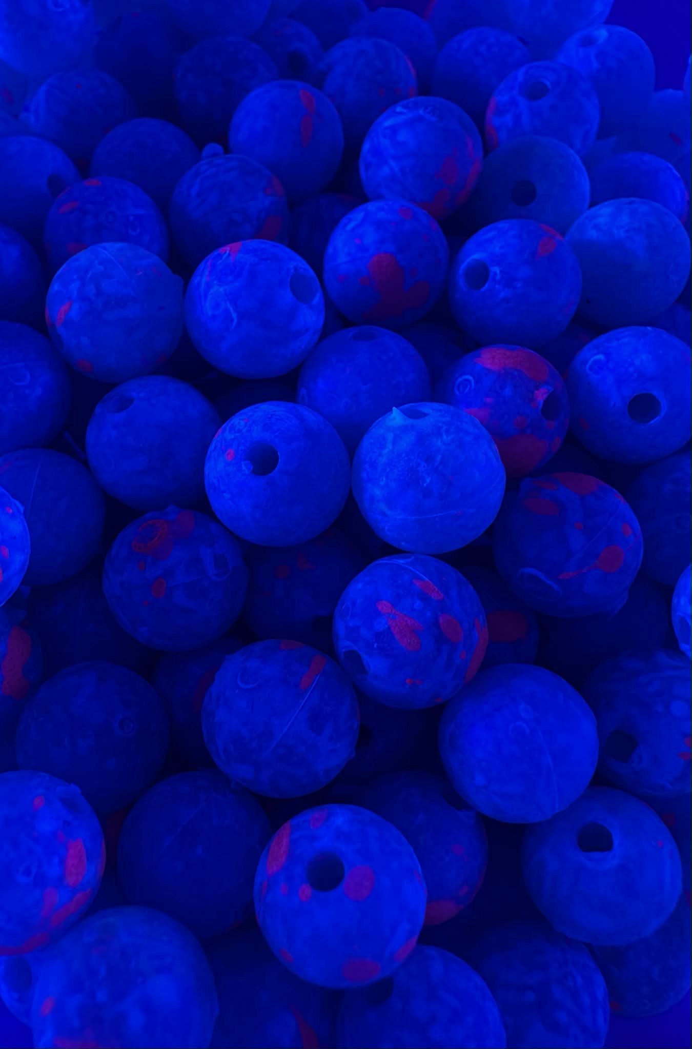 Beadhog UV glow fishing beads, deep blue with pink speckles and drilled hole