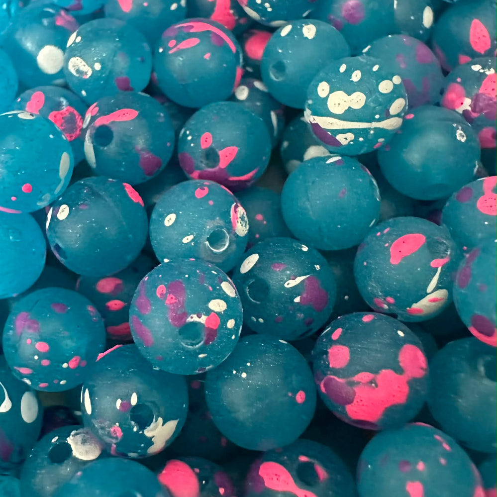 Acid Jazz UV glow fishing beads, teal blue plastic with pink and white speckles