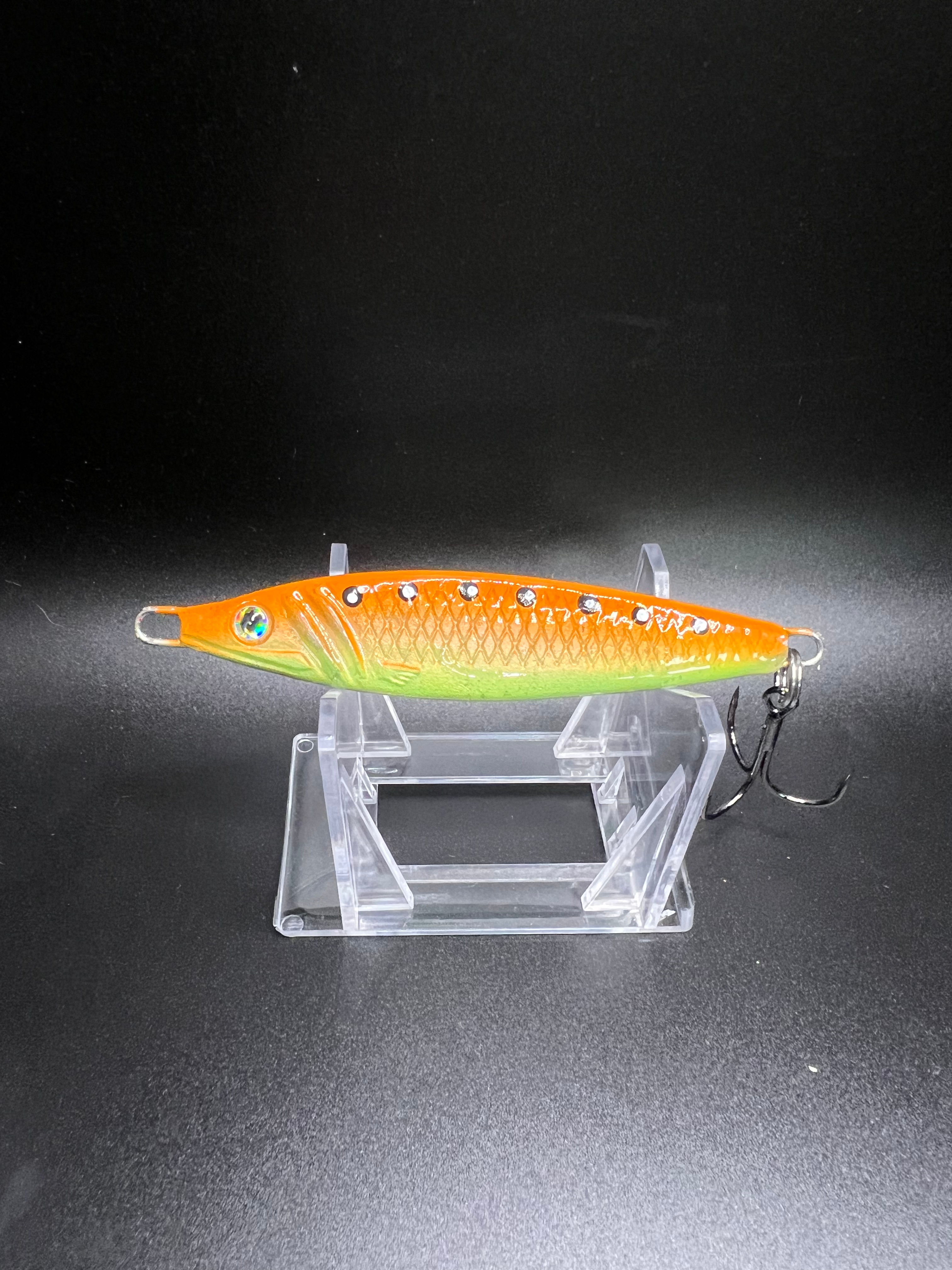 Alexandria 2 oz Jigging Spoon in orange-green with metal hook