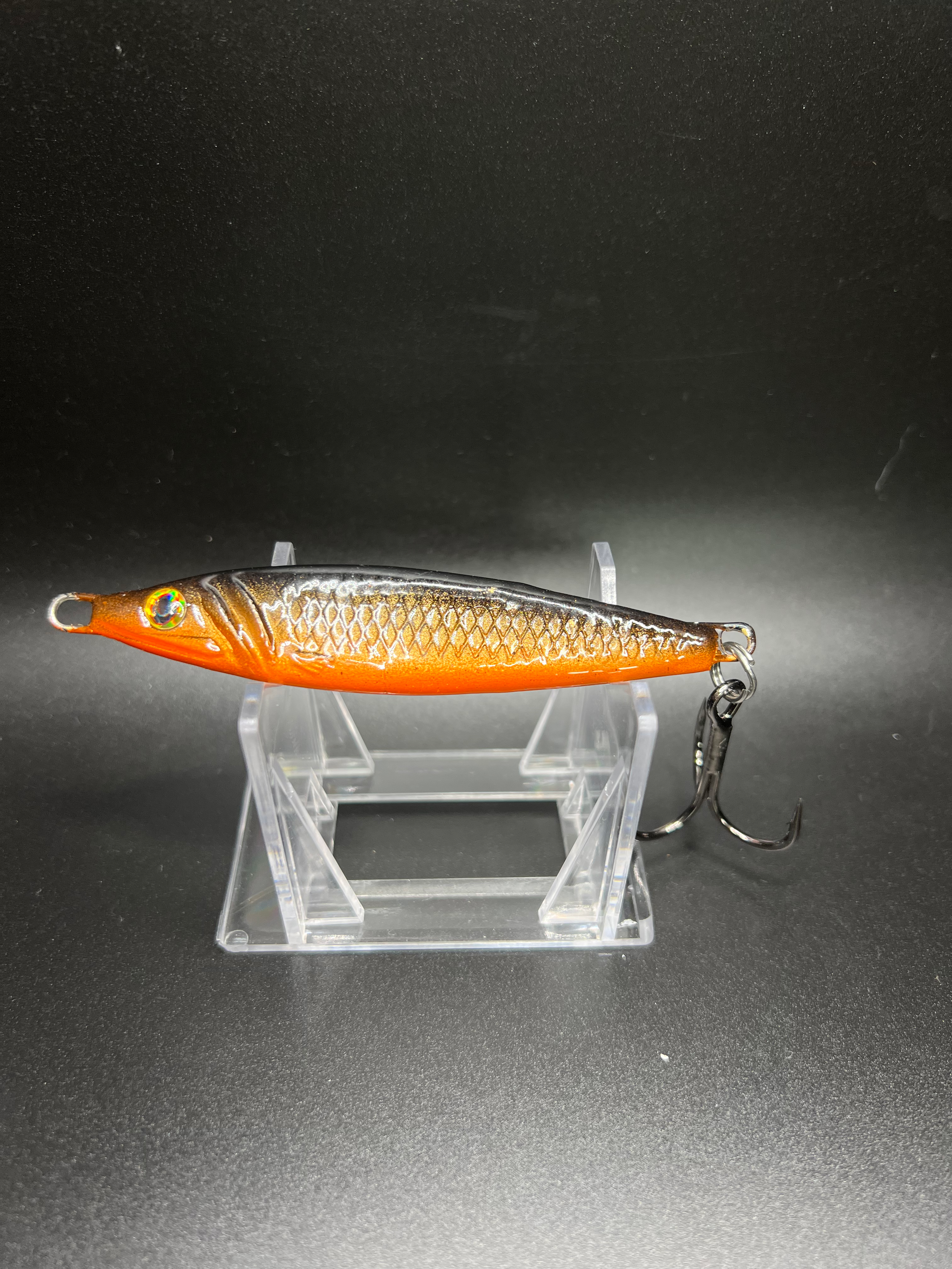Yellowcarp 2 oz jigging spoon in orange with holographic scales, single treble hook