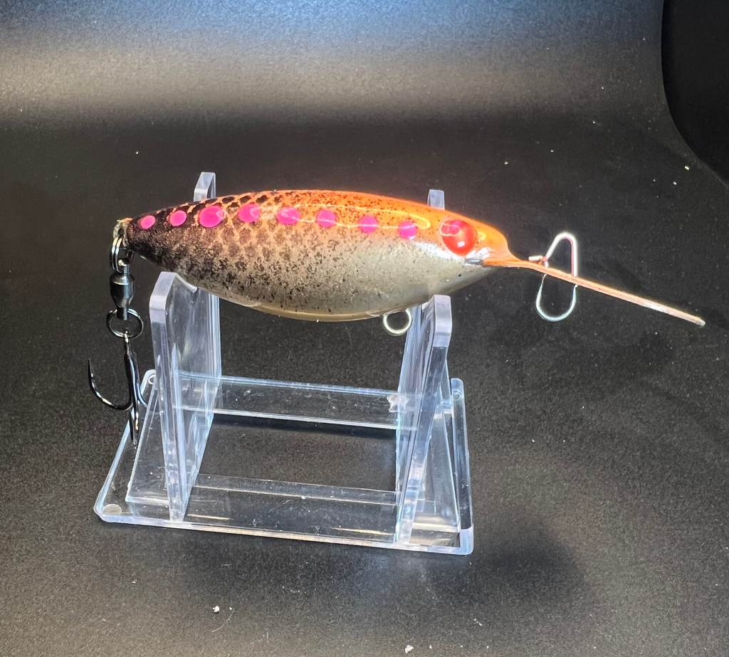 Orange-brown trolling plug with pink spot pattern, lip and exposed treble hook